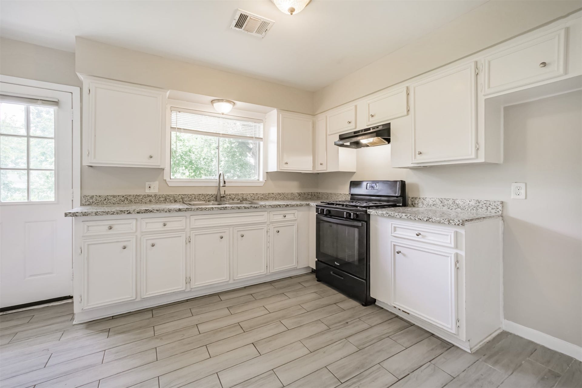 Beautiful kitchen has granite counters and ceramic tile floor!