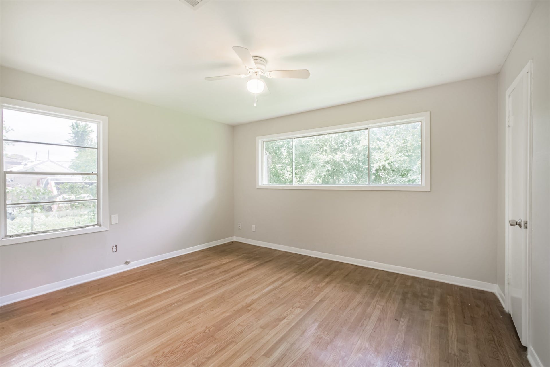 Large Primary bedroom looks out to backyard
