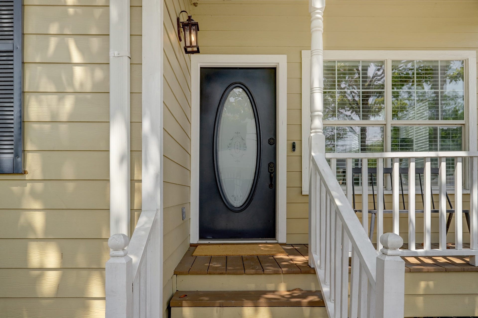 803 Dorothy Street, Houston, TX 77007 Welcoming front entrance with a distinctive oval-glass door, covered porch, and timeless Heights character.