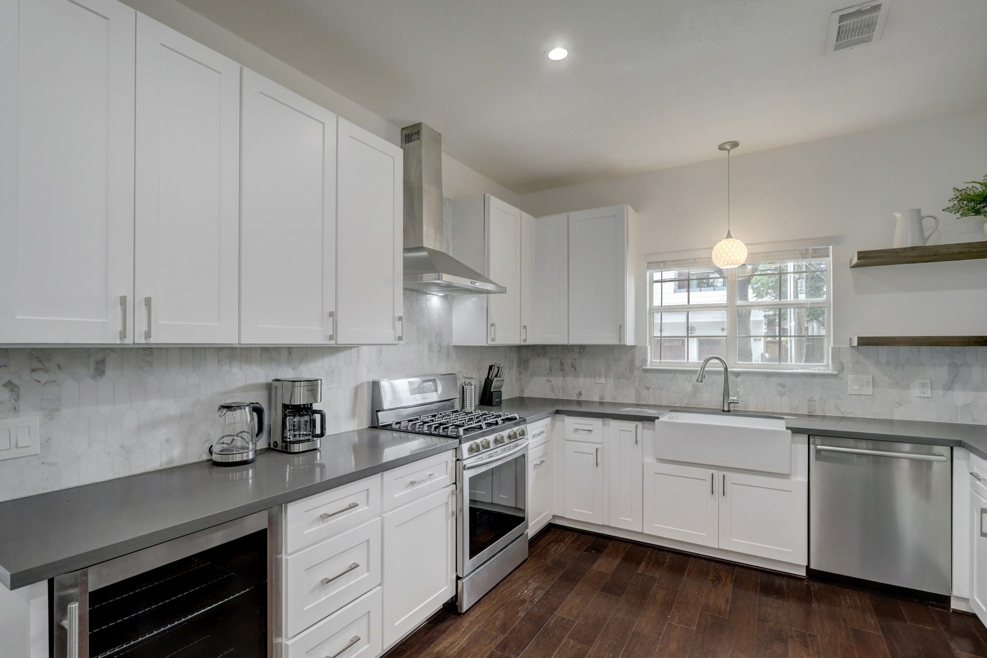 803 Dorothy Street, Houston, TX 77007 Spacious kitchen features white cabinetry, stainless steel appliances, and generous counter space.