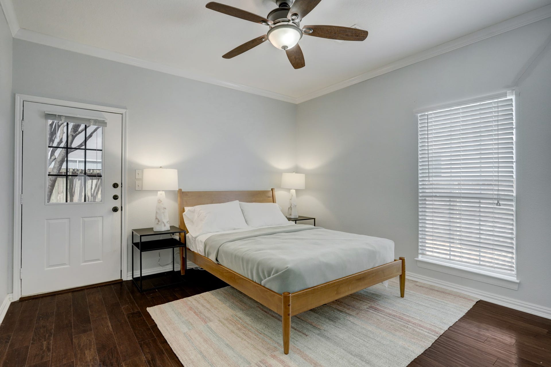 803 Dorothy Street, Houston, TX 77007 Light-filled primary bedroom with ceiling fan, comfortable furnishings, and easy access to closet storage.