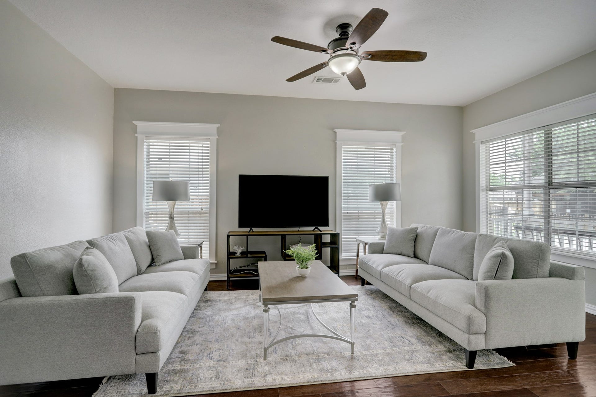 803 Dorothy Street, Houston, TX 77007 Bright, comfortable living room with beautiful wood floors, ceiling fan, and plenty of natural light.
