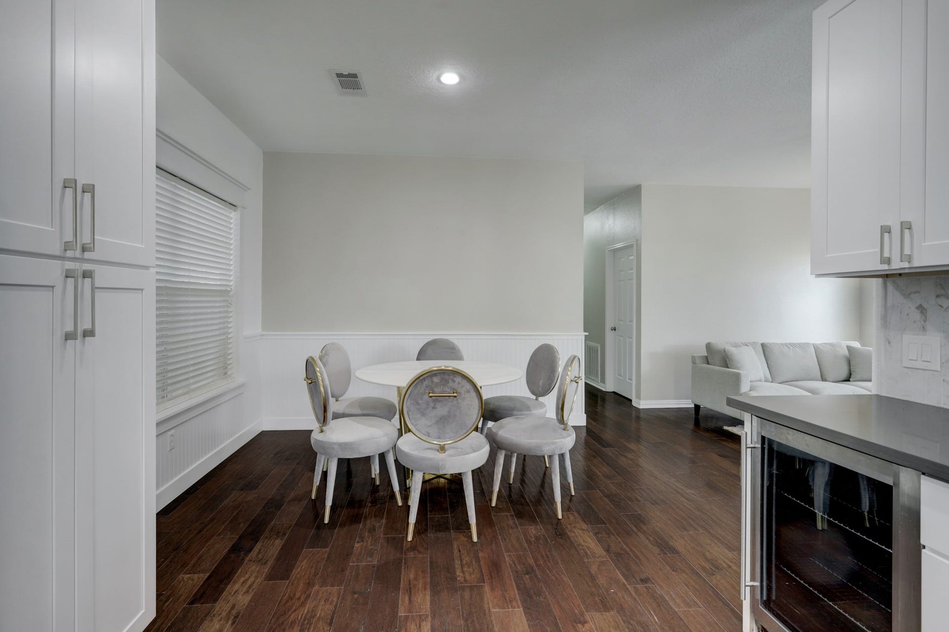 803 Dorothy Street, Houston, TX 77007 Convenient dining area situated just off the kitchen, with beautiful wood flooring throughout the main living spaces. Pantry on the left.