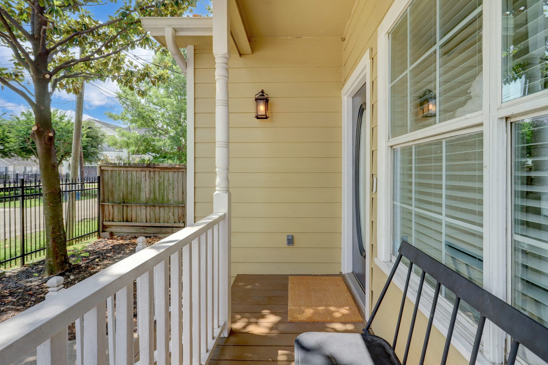 803 Dorothy Street, Houston, TX 77007 A closer look at the inviting front porch, complete with white railings and large windows that bring natural light indoors.