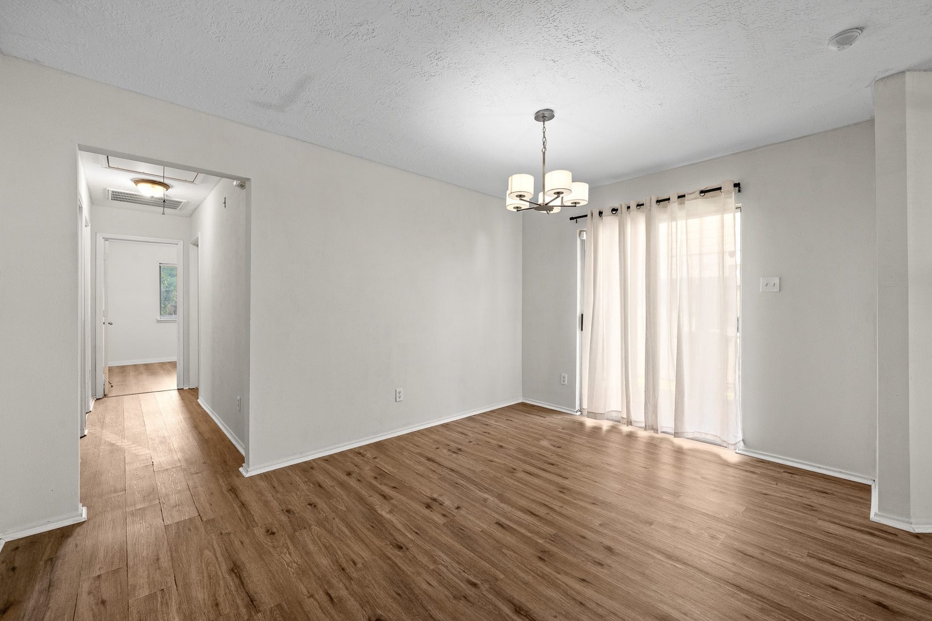 15506 Appleridge Drive, Houston, TX 77489 Bright dining area with, modern lighting, and sheer curtains allowing natural light to flow in.