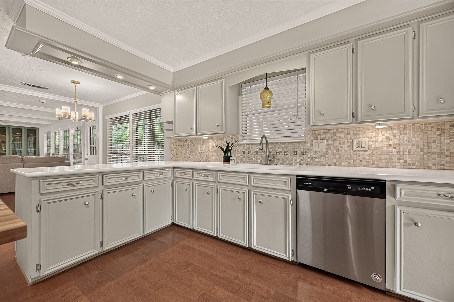 8007 Vickridge Lane, Spring, TX 77379 Generous cabinetry, a beautiful mosaic backsplash, and ample counter space make this kitchen as practical as it is inviting