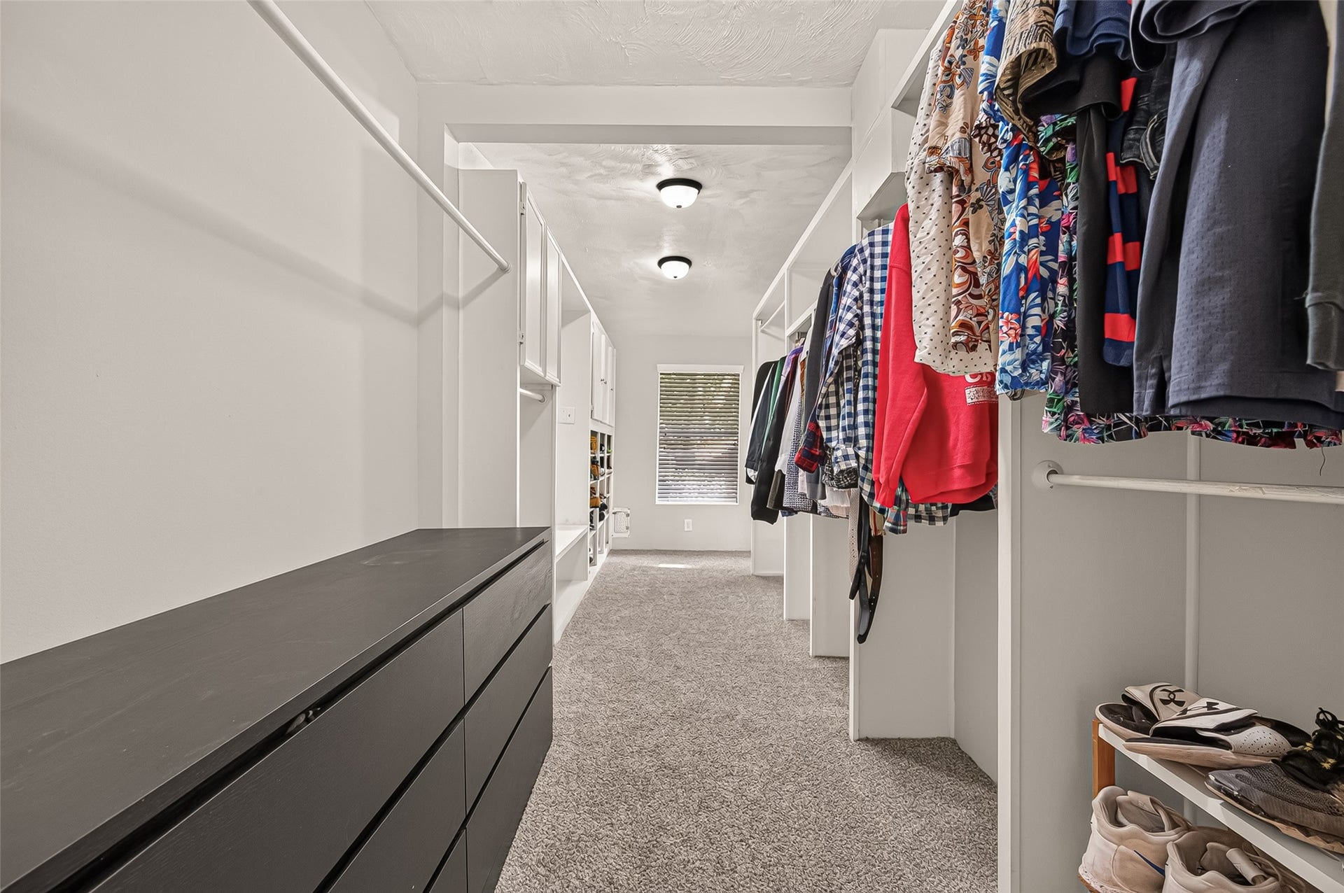 8007 Vickridge Lane, Spring, TX 77379 Spacious walk-in closet with natural light from two windows and abundant storage