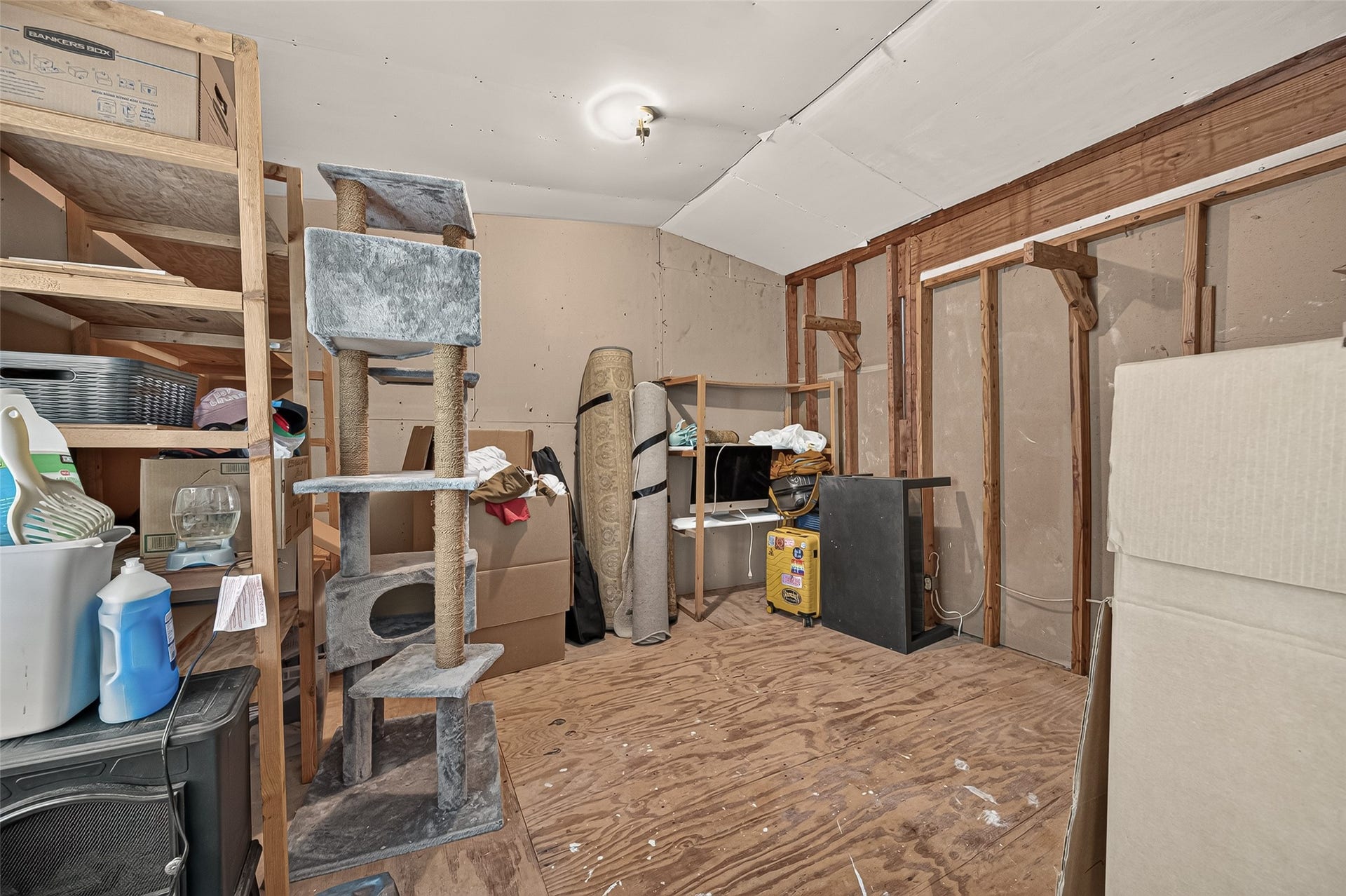 8007 Vickridge Lane, Spring, TX 77379 One of two walk in attic storage spaces off the flex room