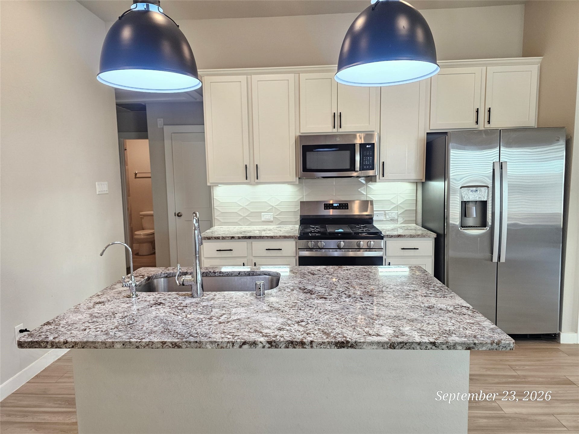 21614 Wave Hollow Drive, Cypress, TX 77433 Large granite island, and under cabinet lighting