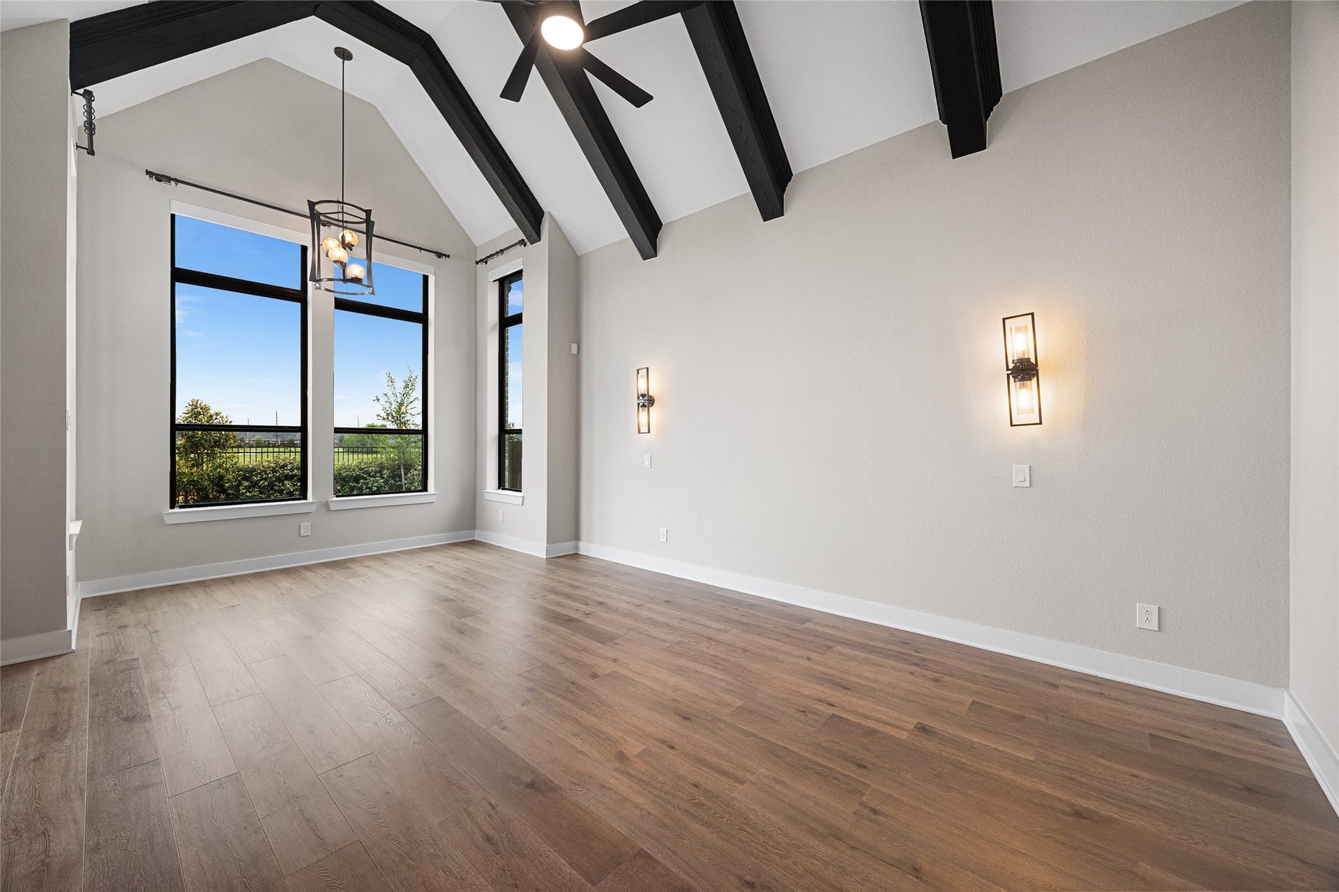 6707 Nimitz Court, Katy, TX 77493 Spacious retreat with vaulted ceilings, exposed beams, and expansive windows that fill the room with natural light, creating an airy and inviting atmosphere.