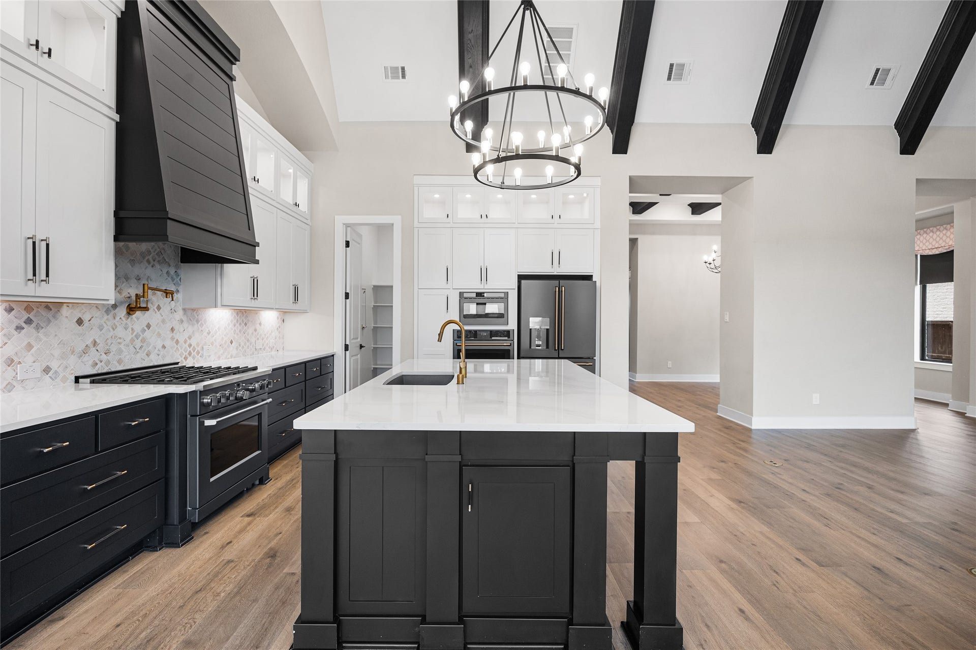 6707 Nimitz Court, Katy, TX 77493 Open-concept kitchen showcasing extensive cabinetry, built-in appliances, and a spacious layout ideal for entertaining and everyday living.