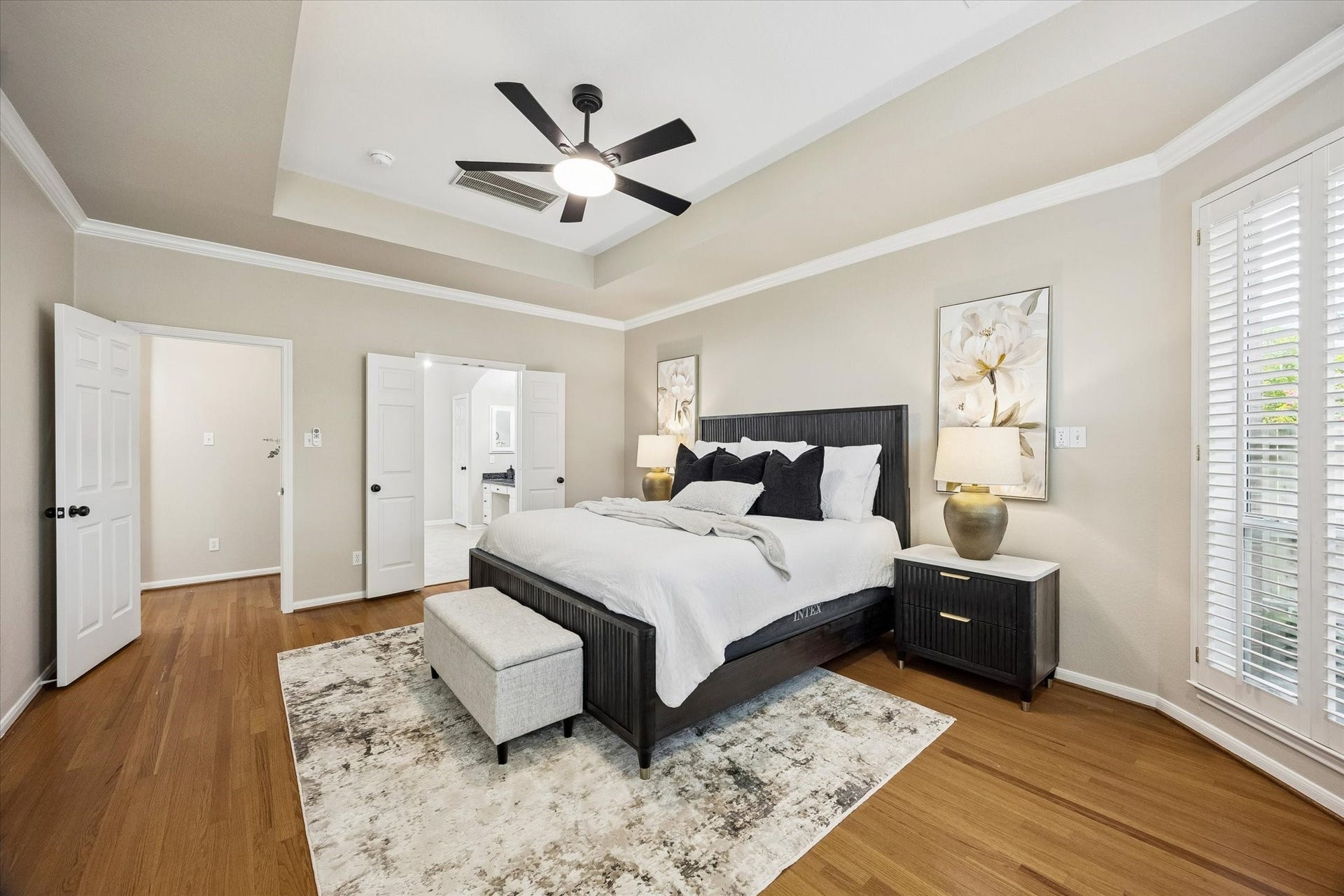 7535 Guinevere Drive, Sugar Land, TX 77479 Tray ceilings and generous proportions create an airy, relaxing atmosphere. Primary bedroom on the first floor