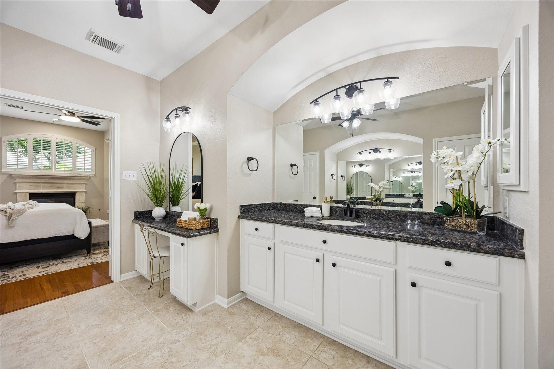 7535 Guinevere Drive, Sugar Land, TX 77479 Primary Bath - A freestanding soaking tub and oversized walk-in shower with dual shower heads bring a spa-inspired feel to the space