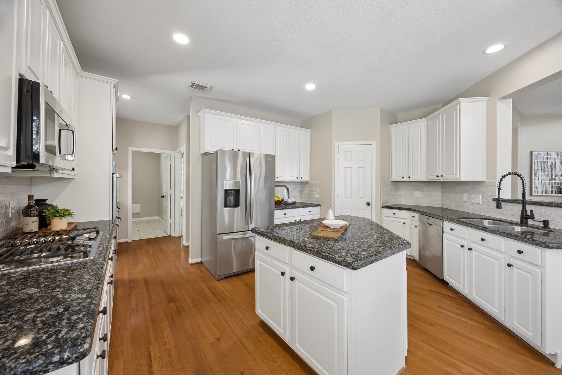 7535 Guinevere Drive, Sugar Land, TX 77479 Another view of the functional kitchen with generous amounts of storage and counter space