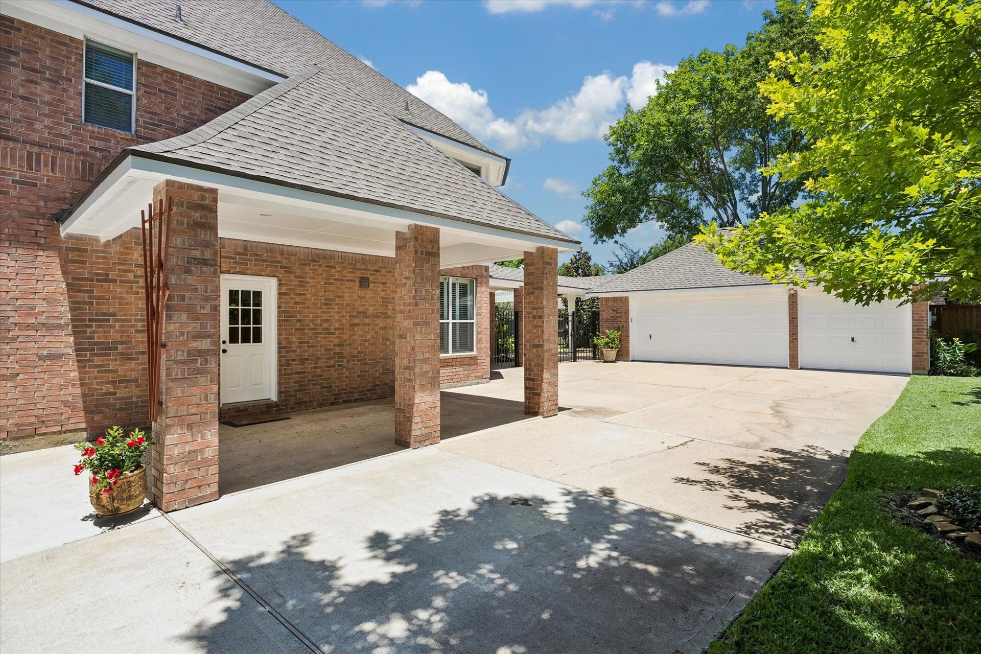 7535 Guinevere Drive, Sugar Land, TX 77479 The extended drive offers ample parking and easy access to the detached three-car garage
