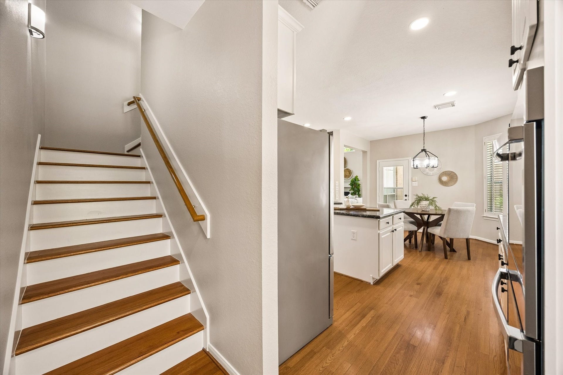 7535 Guinevere Drive, Sugar Land, TX 77479 The functional layout offers a second staircase for easy access upstairs, located near the side door of the home.