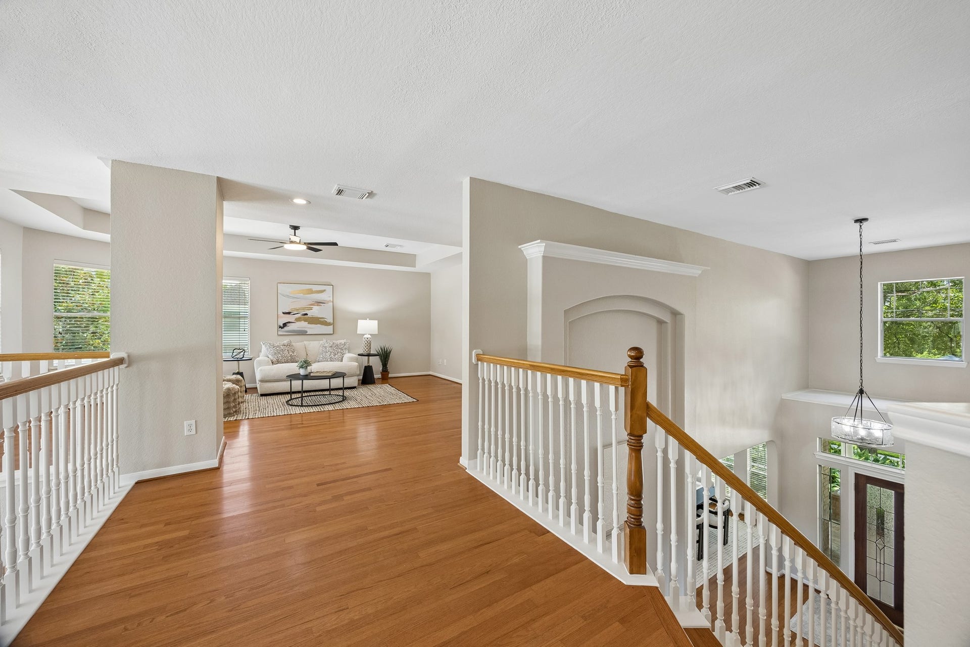 7535 Guinevere Drive, Sugar Land, TX 77479 Upstairs has the same wood flooring you'll find downstairs and on both sets of stairs