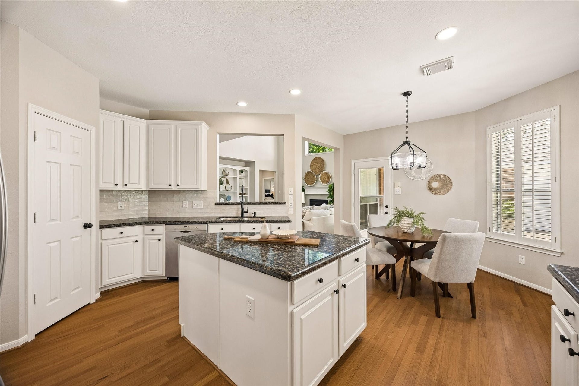 7535 Guinevere Drive, Sugar Land, TX 77479 The spacious island anchors the kitchen and provides an ideal gathering spot for everyday living