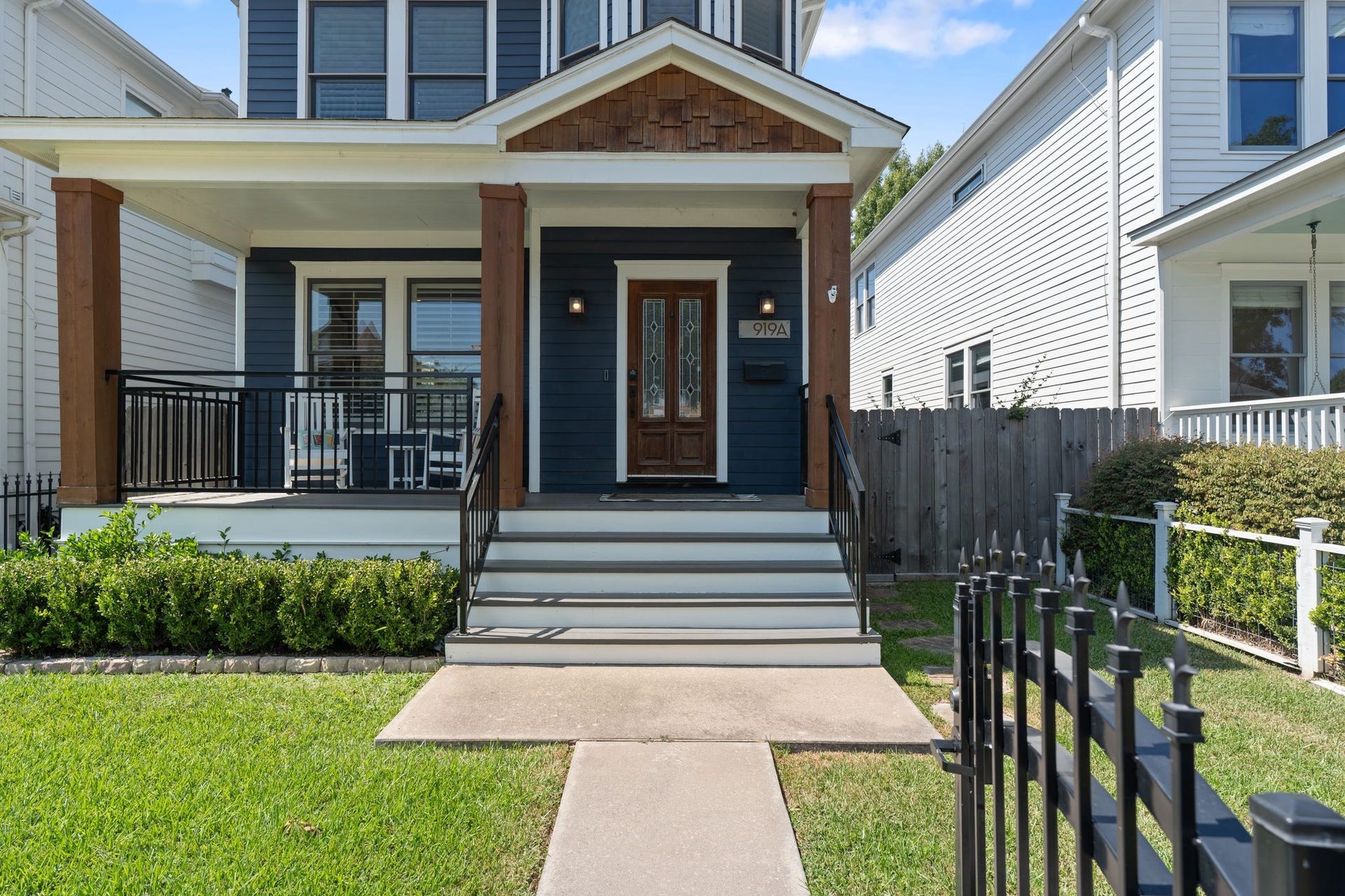 919 Ashland Street, #A, Houston, TX 77008 Another look at this updated Heights home showcasing the covered front porch, fenced-in grass space & inviting curb appeal. Wide front steps lead to the porch w/ 2 exterior light fixturesperfect for enjoying morning coffee or relaxing outdoors!