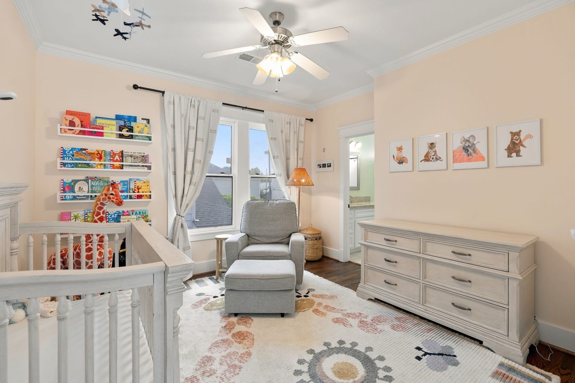 919 Ashland Street, #A, Houston, TX 77008 Spacious secondary bedroom #1 located upstairs w/ 2 large windows, ceiling fan + double-door closet featuring built-in shelving & hanging storage. Convenient direct access to the shared secondary bath at the upper right.
