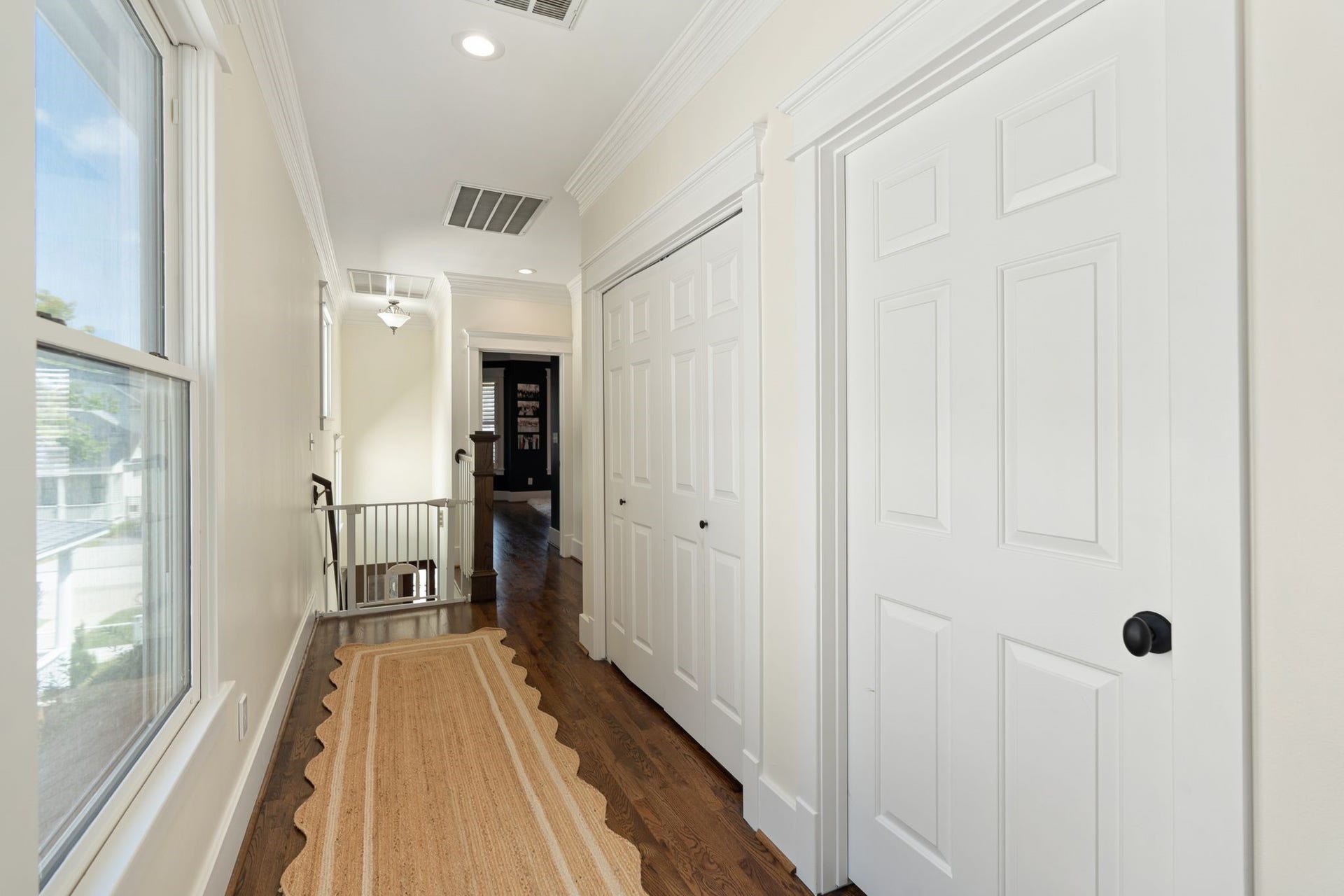 919 Ashland Street, #A, Houston, TX 77008 Upstairs landing connects the primary suite, secondary bedrooms & utility area. Primary suite is privately situated toward the front of the home while the secondary bedrooms are located off the landing. Double doors leads to the utility closet, conveniently located with all bedrooms.