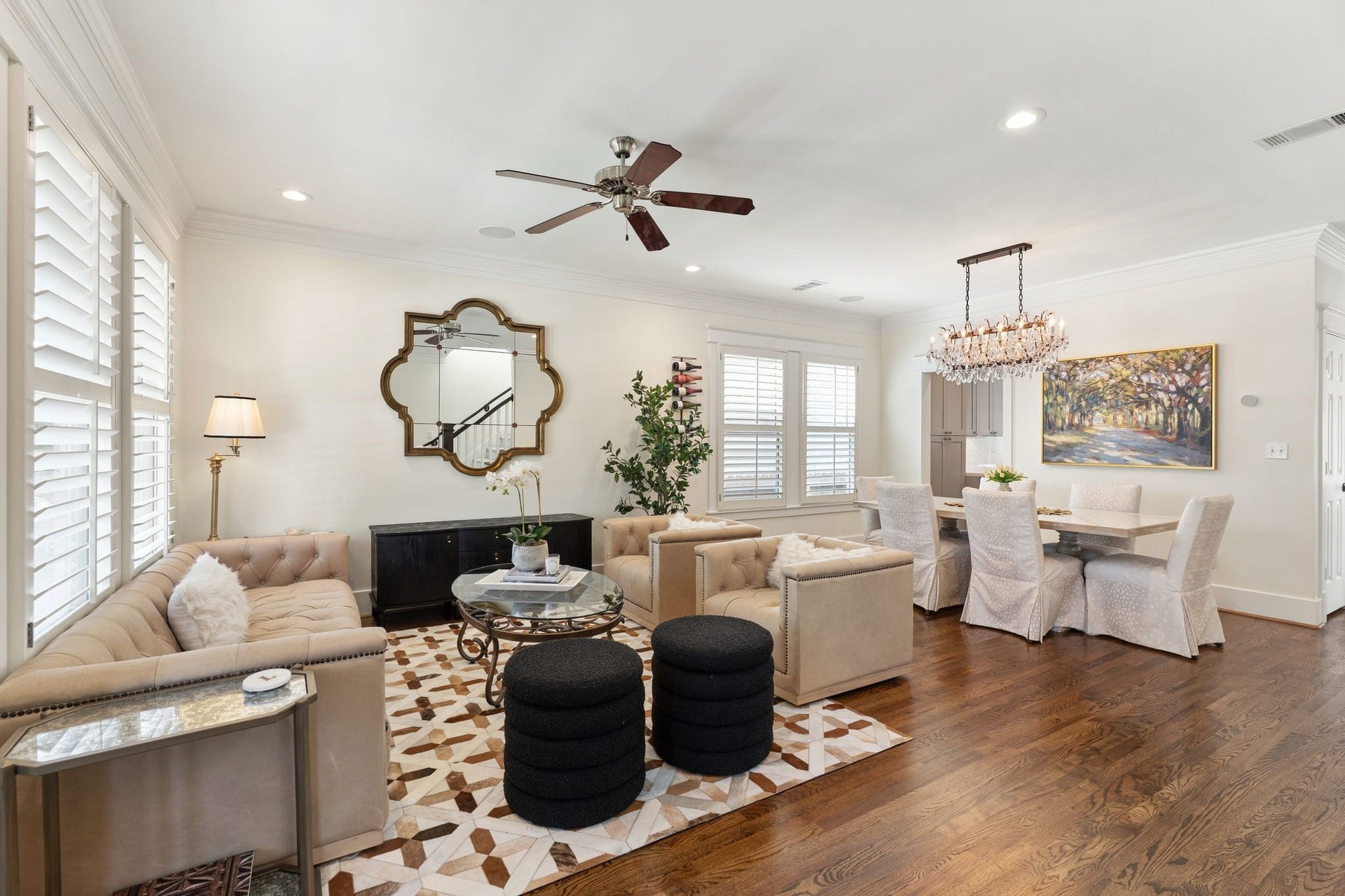919 Ashland Street, #A, Houston, TX 77008 Light-filled living room w/ refinished hardwood floors, crown molding, recessed lighting + windows w/ plantation shutters. Open floor plan w/ the dining room creates wonderful flow for everyday living & entertaining!