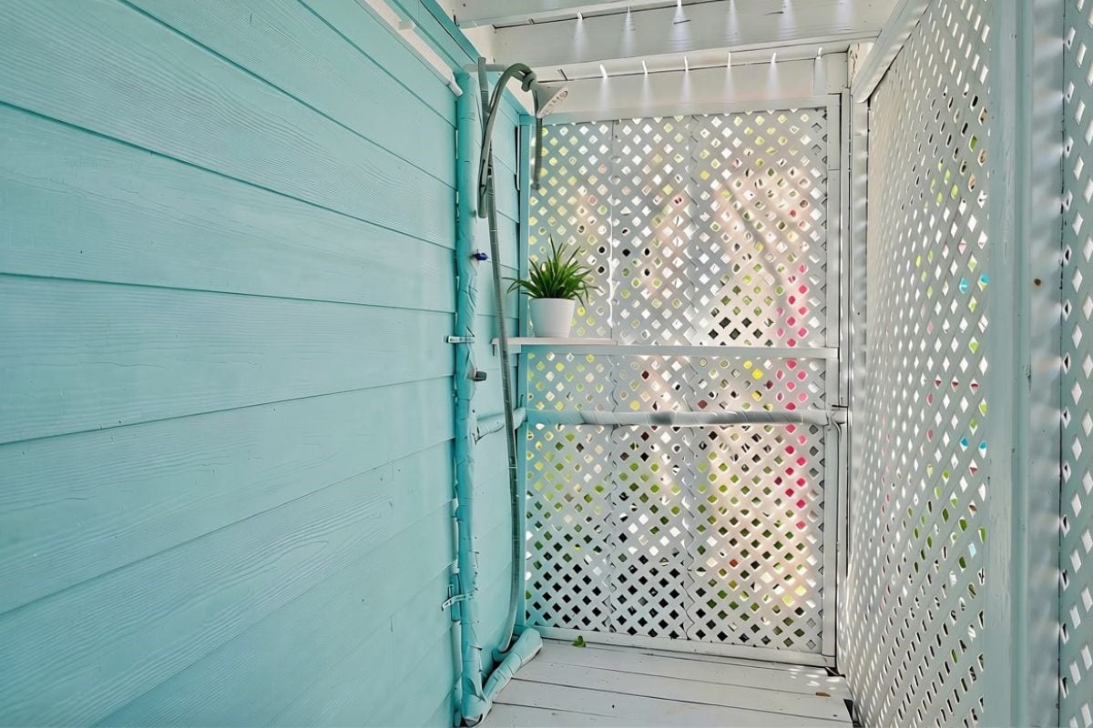 1805 19th Street, Galveston, TX 77550 Outdoor Beach Shower: Enjoy the convenience of this first-floor outdoor beach shower, complete with privacy lattice and coastal-inspired turquoise siding. Perfect for rinsing off sand and saltwater after a sun-filled day at Galveston's beautiful beachesa desirable amenity for coastal living and vacation guests!
