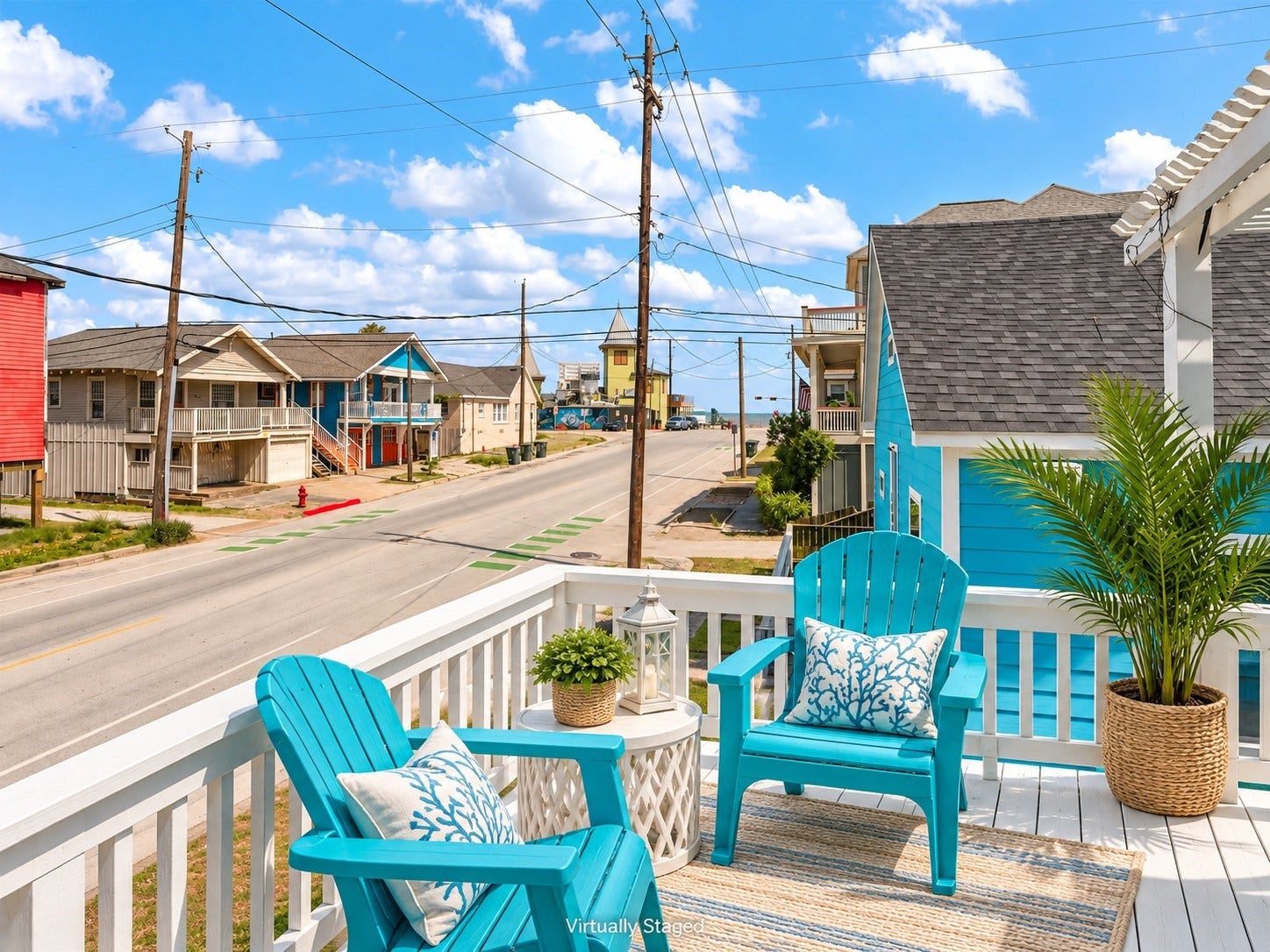1805 19th Street, Galveston, TX 77550 Second-Floor Upper Deck with Coastal Views: Sit back, relax, and enjoy the refreshing Gulf breeze from this inviting second-floor deck! Featuring outdoor seating and views toward the beach, it's the perfect spot to enjoy your morning coffee, unwind after a day in the sun, and listen to the soothing sounds of the nearby waves.