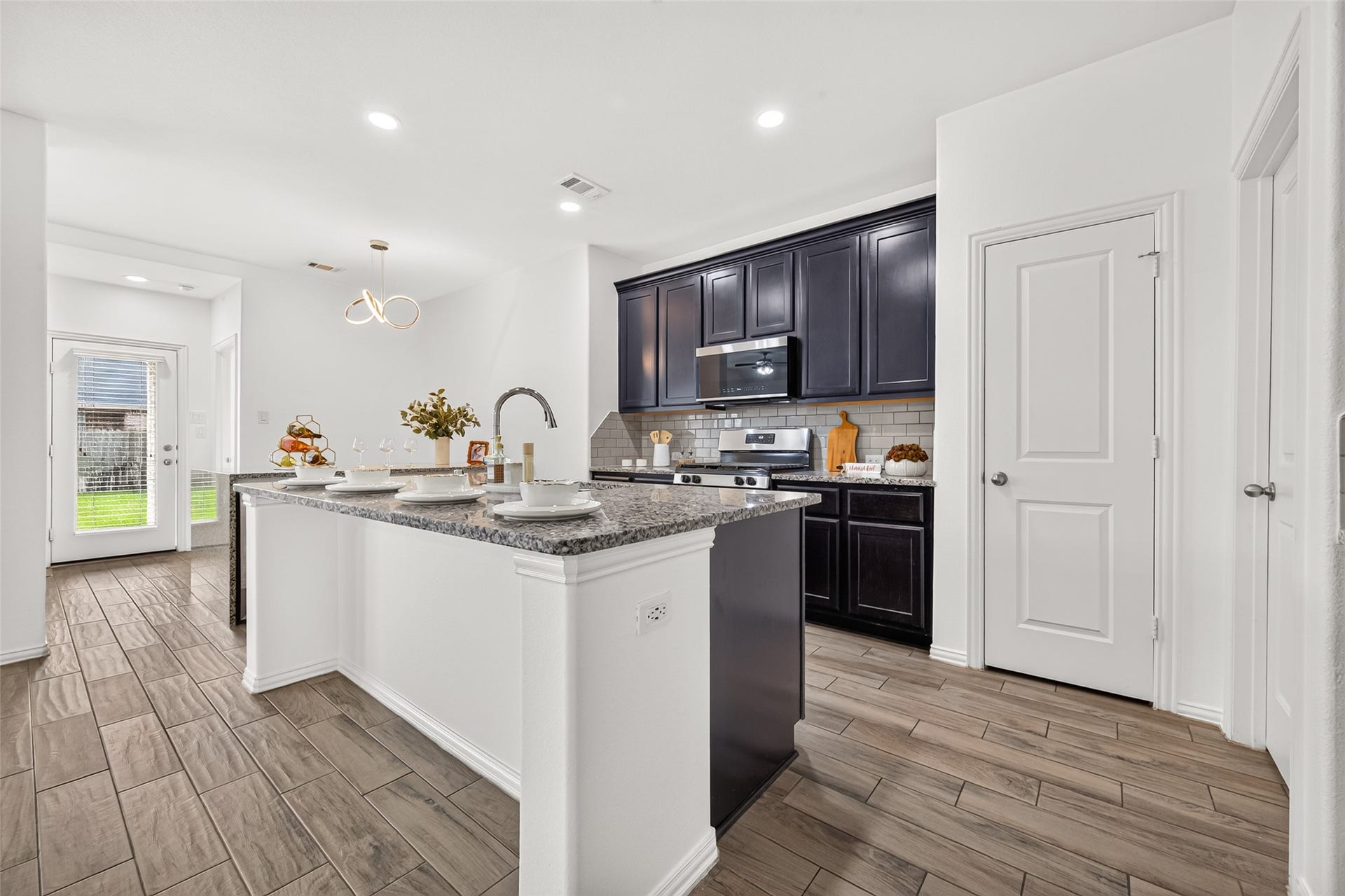 19711 Lakeside Pointe, Richmond, TX 77407 Thoughtful kitchen details include a touchscreen microwave