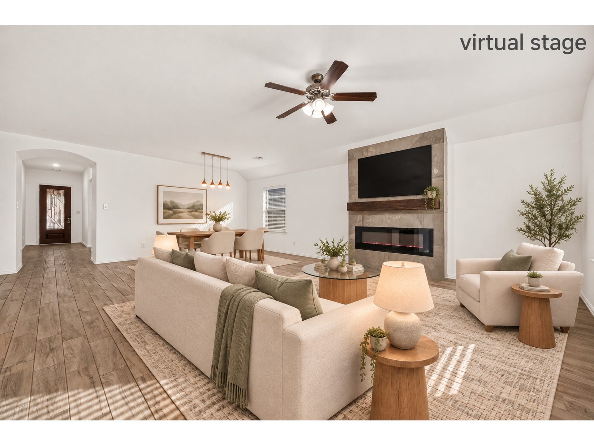 19711 Lakeside Pointe, Richmond, TX 77407 Picture cozy evenings by the fireplace and dinner with friends in this bright, open living and dining space. High ceilings and warm wood-look tile bring the room together beautifully