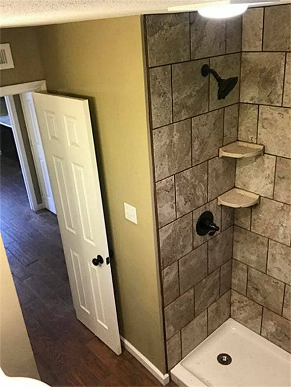 Tile shower with easy access and low step.
