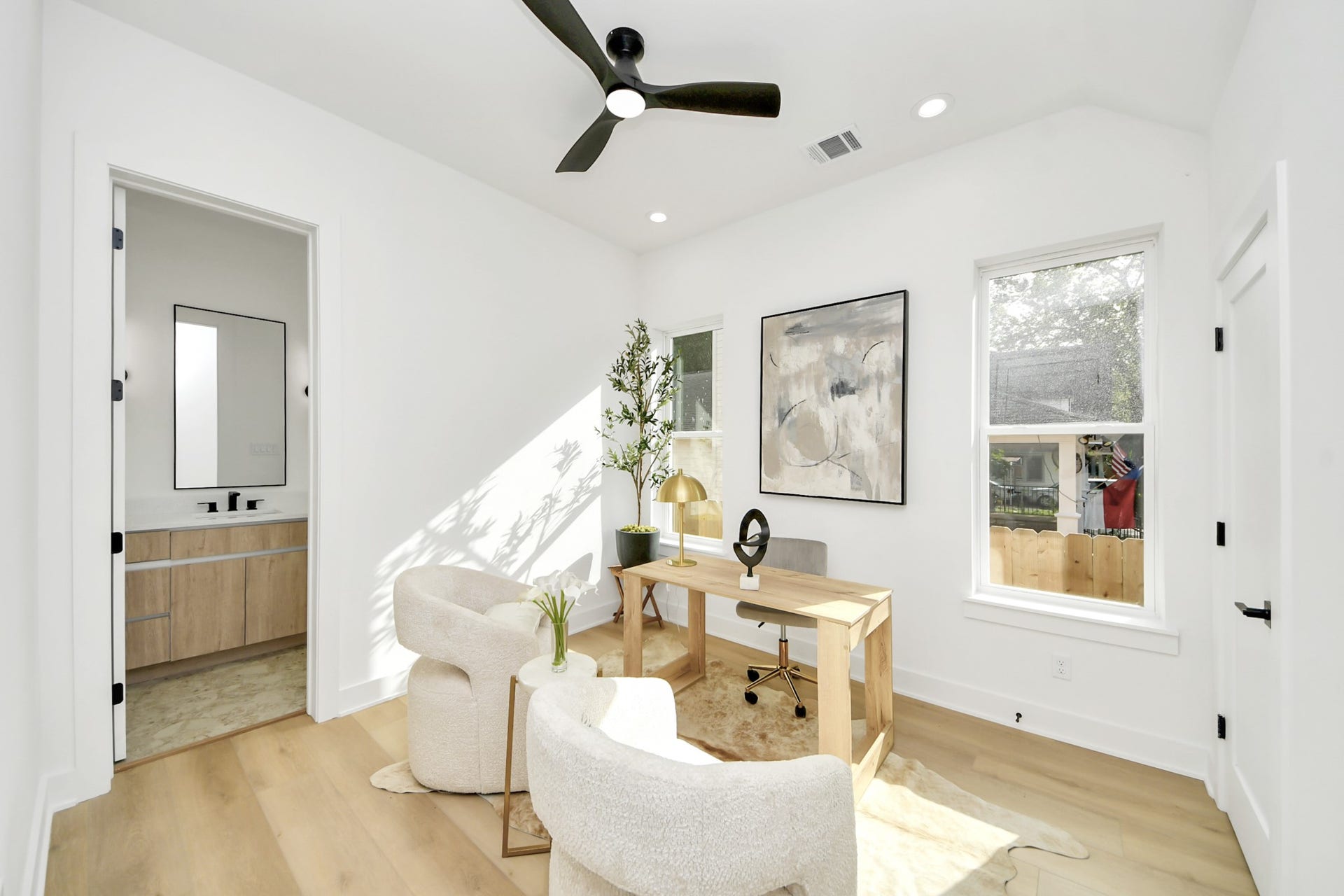 1603 W 25th Street, Houston, TX 77008 Home office with a dedicated workspace, seating area, and convenient access to a full bathroom.