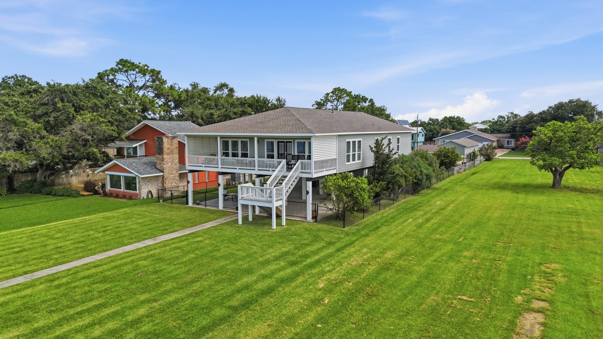 2534 Cliff Drive, San Leon, TX 77539 Step out onto a grand, beautifully manicured lawn that leads straight to the water's edge.