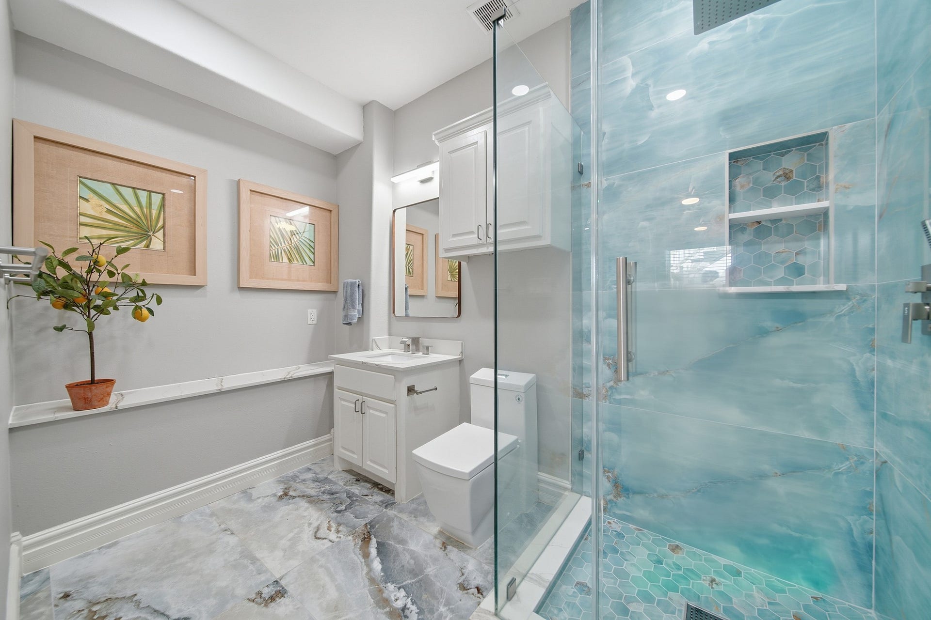2534 Cliff Drive, San Leon, TX 77539 Pamper visitors in a fully finished, modern bathroom with a custom walk-in shower.