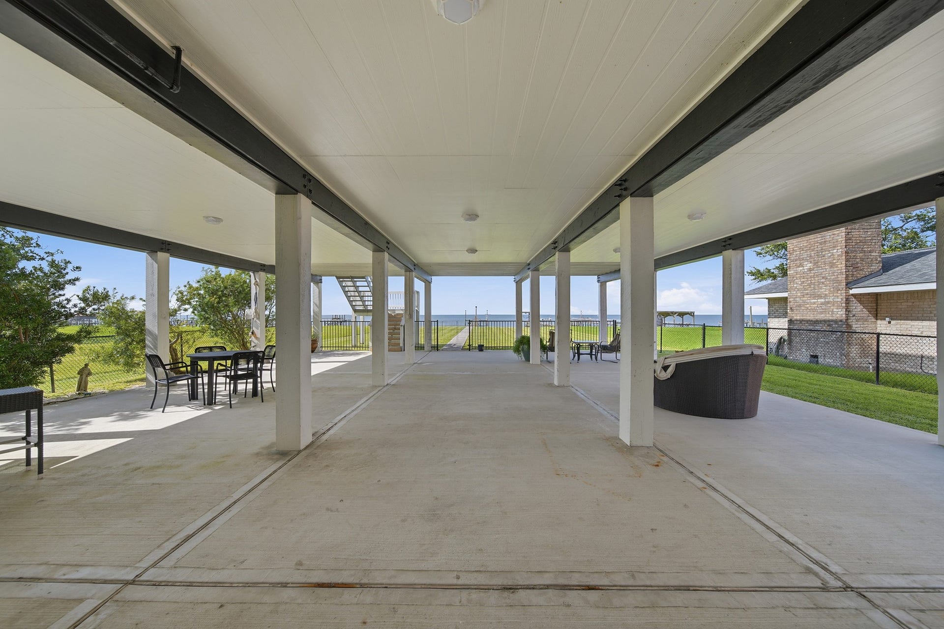2534 Cliff Drive, San Leon, TX 77539 Relax on a massive ground-level patio built for ultimate coastal living.