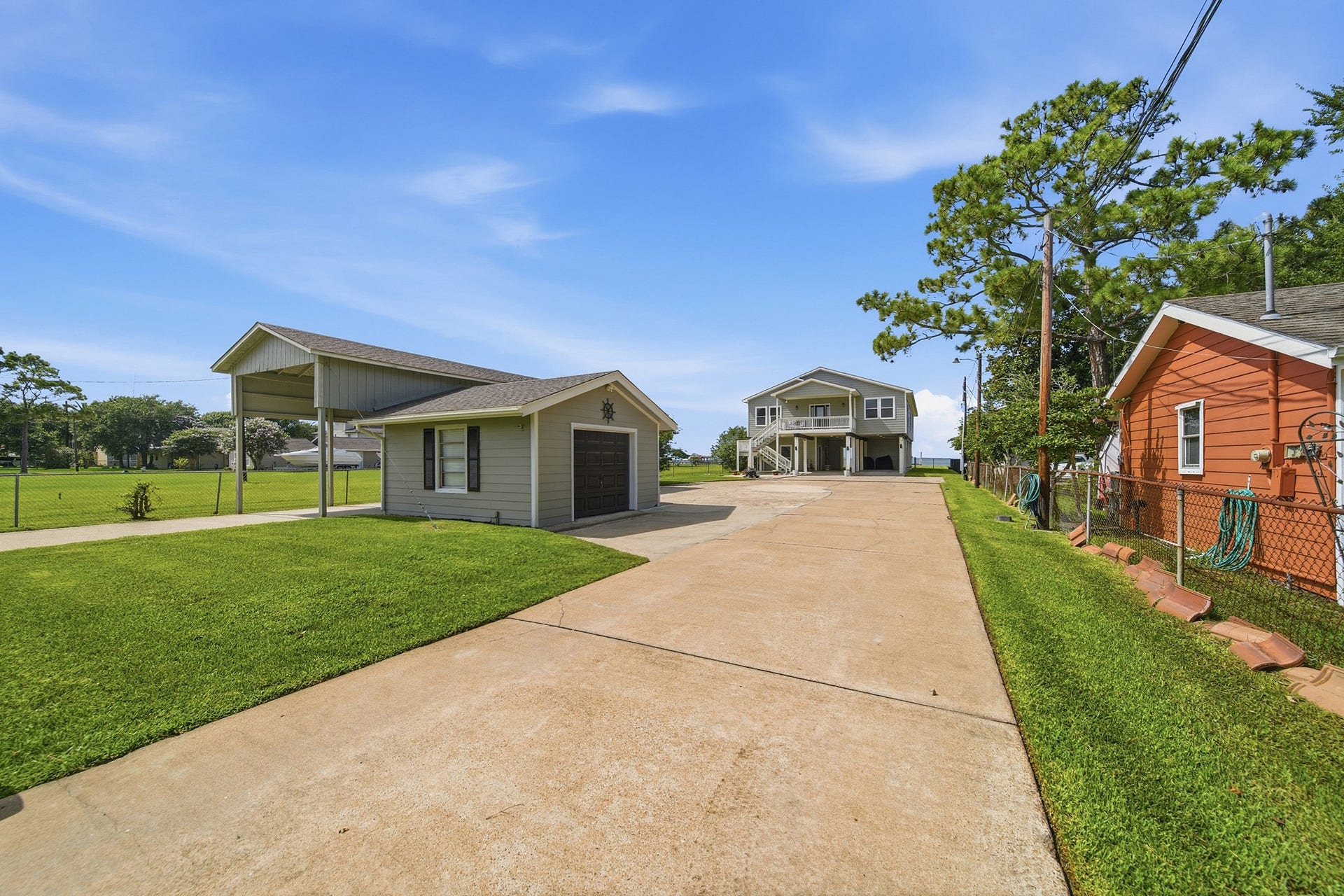 2534 Cliff Drive, San Leon, TX 77539 A secure, gated entrance welcomes you down a pristine, expansive driveway.