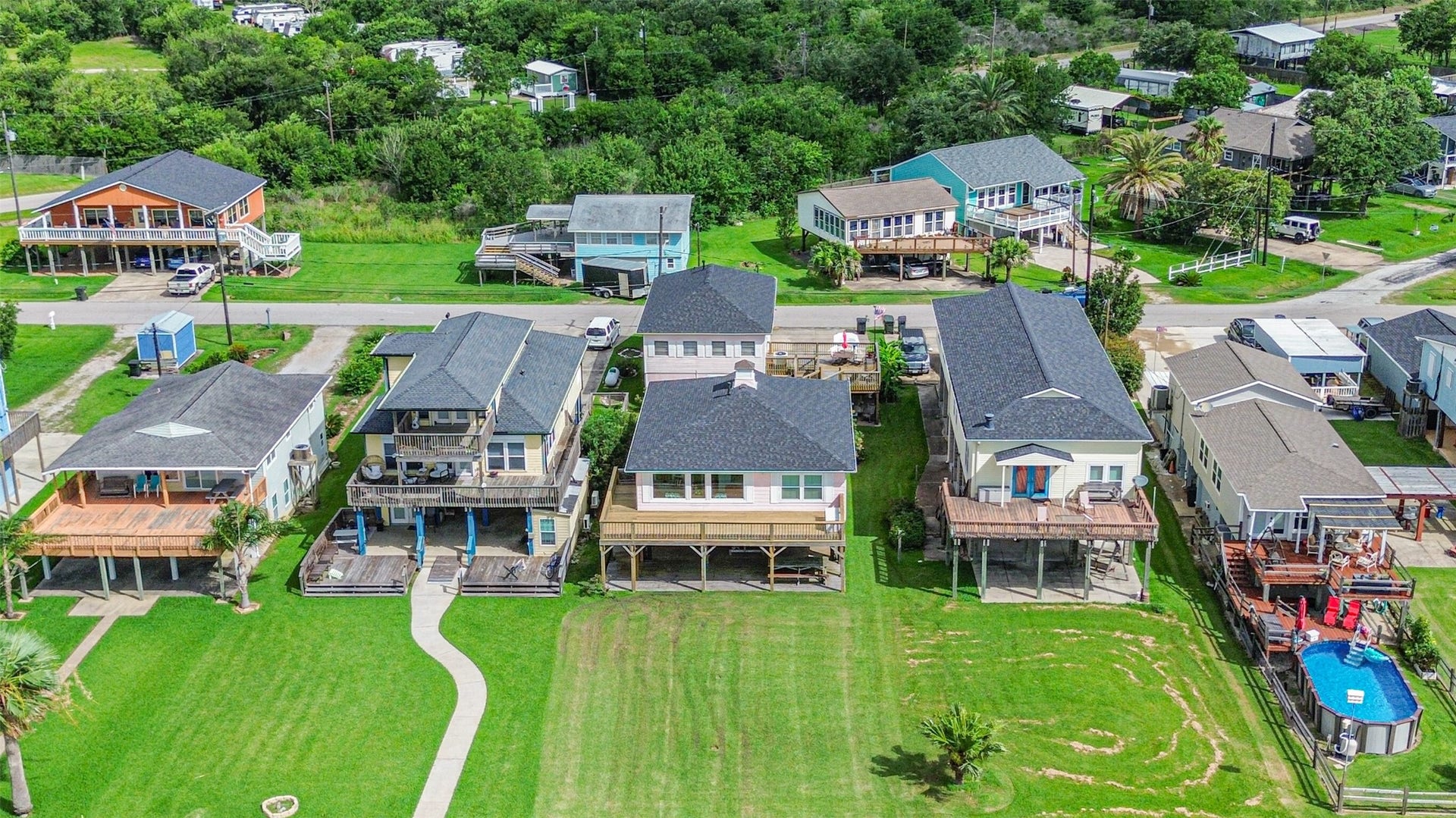 1521 John Street, San Leon, TX 77539 Subject property is the third home from the left in the aerial image.