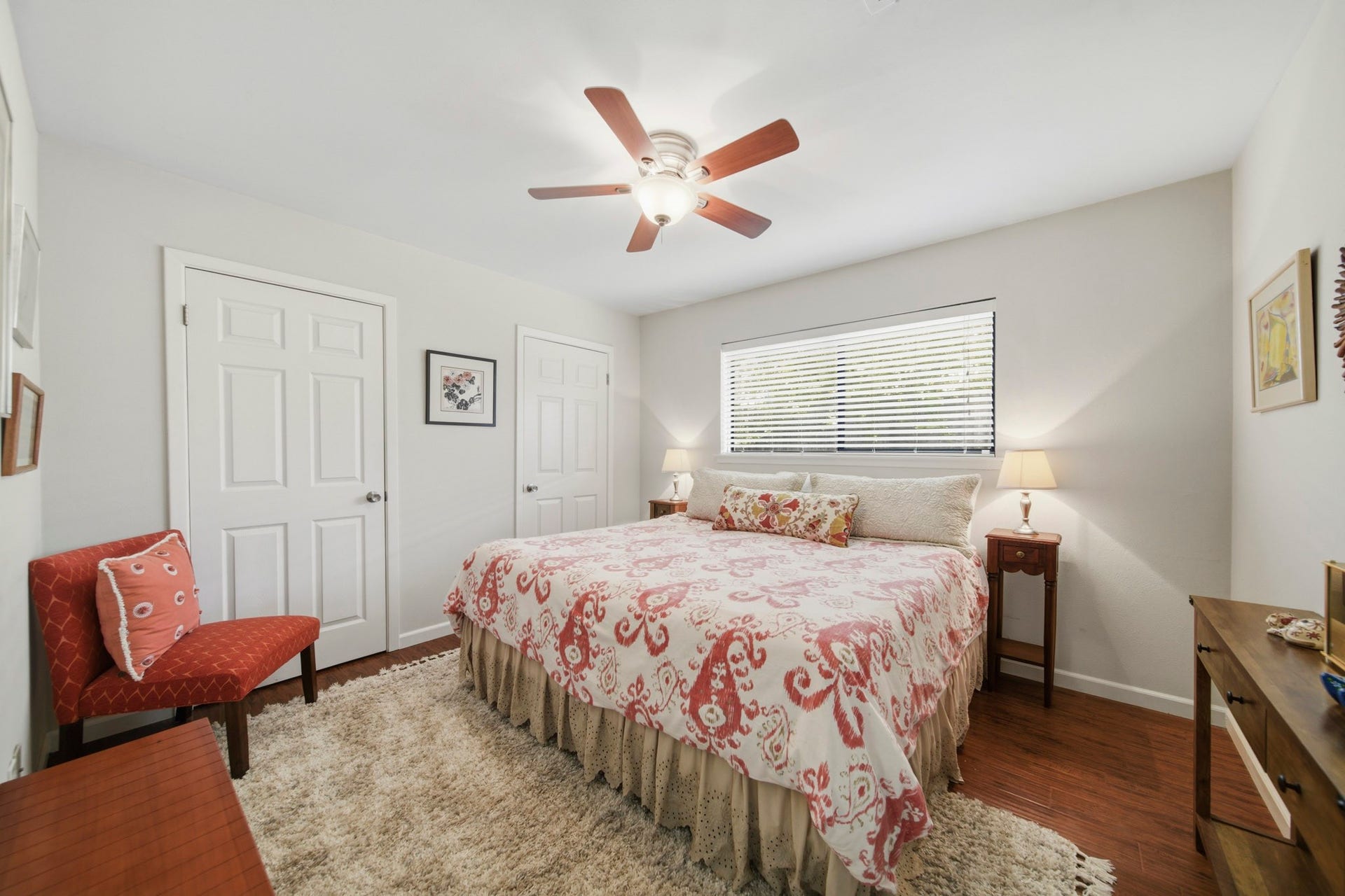 This spacious third bedroom offers a bright, comfortable retreat with abundant natural light, neutral finishes, and warm wood-look flooring. A generous layout and ample closet space make it ideal for family, guests, or a flexible home office to fit your needs.