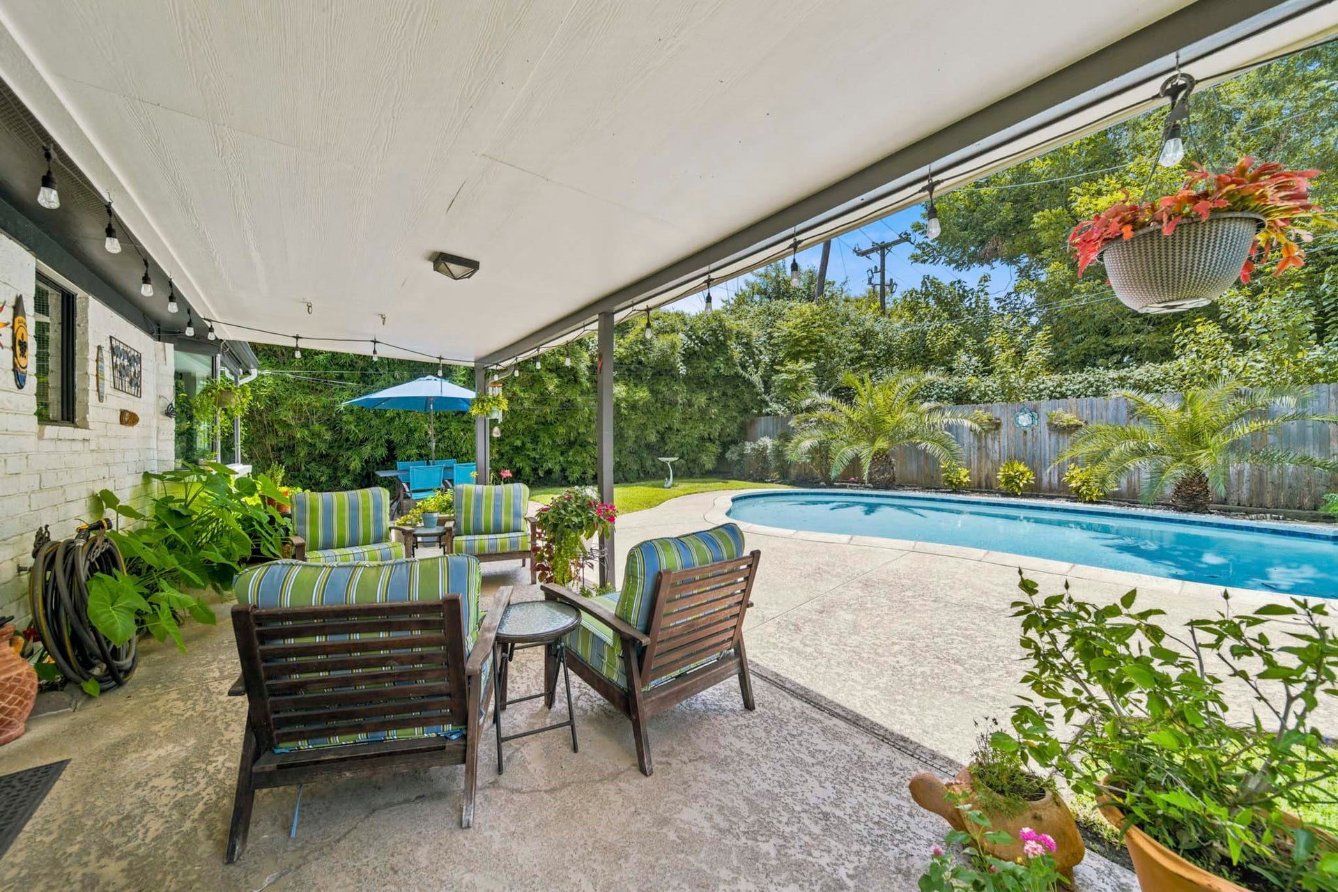 Extend your living space outdoors with this expansive covered patio overlooking a sparkling pool and lush, private backyard. Thoughtfully designed for effortless entertaining and everyday relaxation, this inviting retreat offers plenty of room for outdoor dining, lounging, and enjoying peaceful evenings under the moon light.