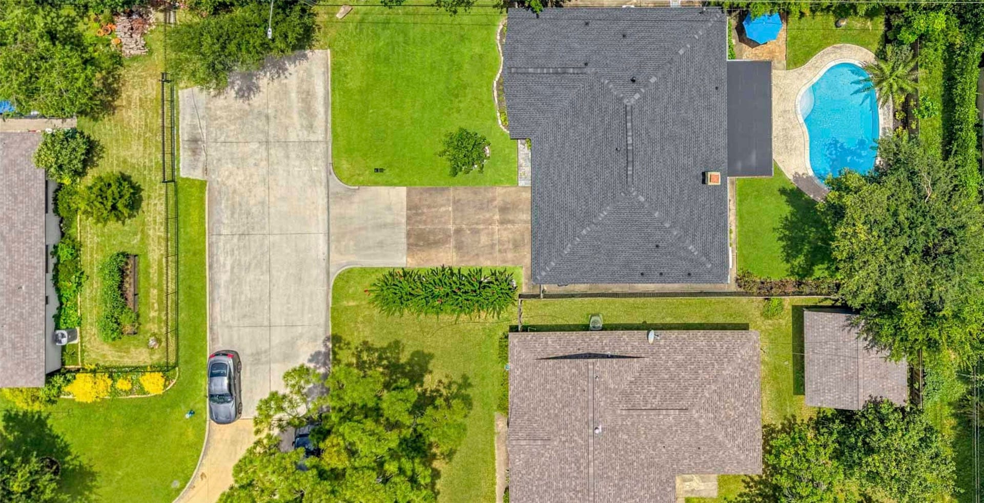 Situated on an oversized lot, this home offers exceptional outdoor living with a sparkling pool, expansive green space, and an extended driveway providing ample parking for guests, recreational vehicles, or a sport court. The generous backyard delivers the perfect blend of privacy, play, and entertaining space.