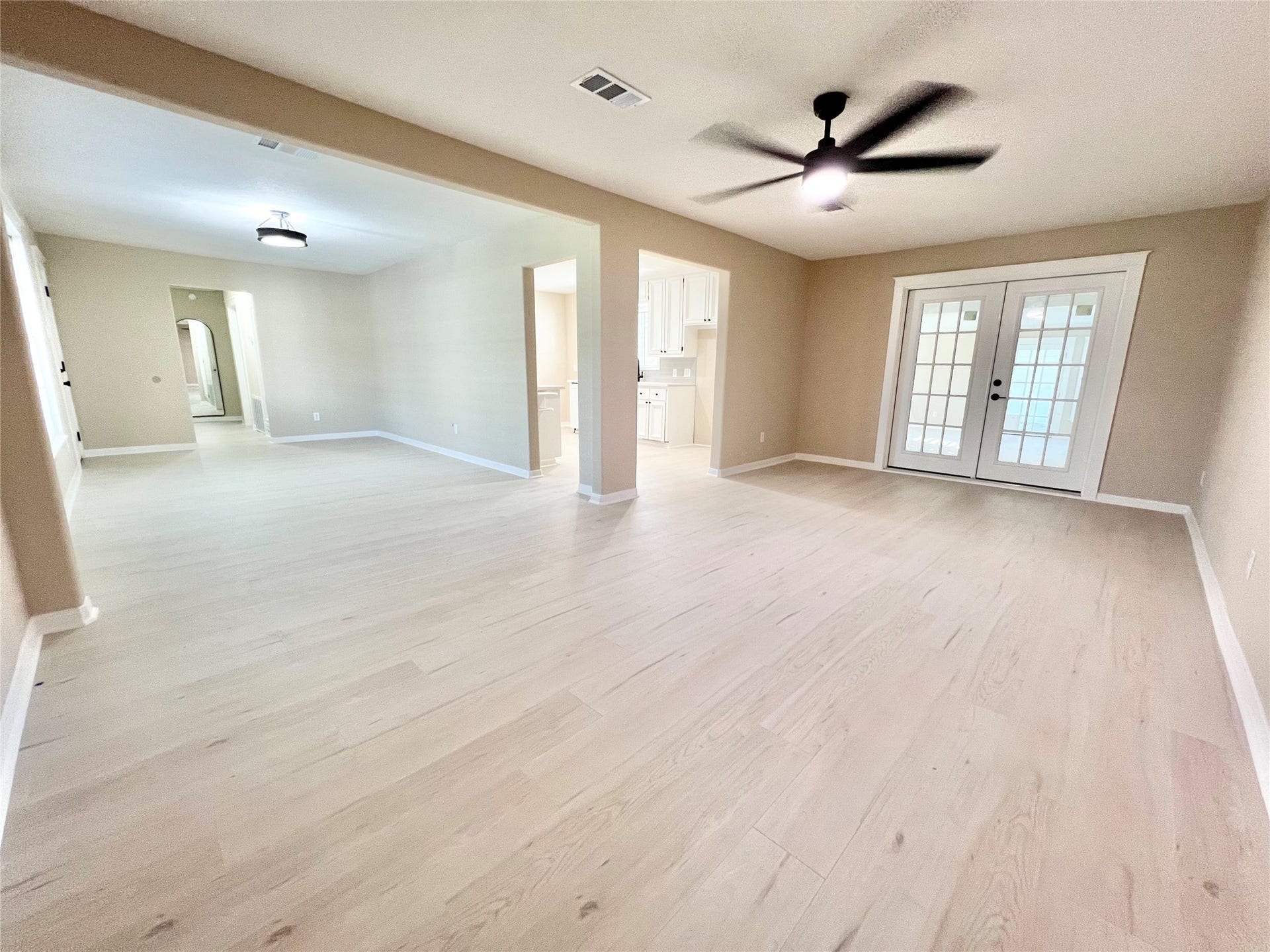 3806 Peck Street, Santa Fe, TX 77517 Better vantage point to see the dining room to the left and the family room to the right, Kitchen accessed through the openings in the middle. French doors lead to a massive Flex Room that can be a great game room or office or whatever you decide it should be.