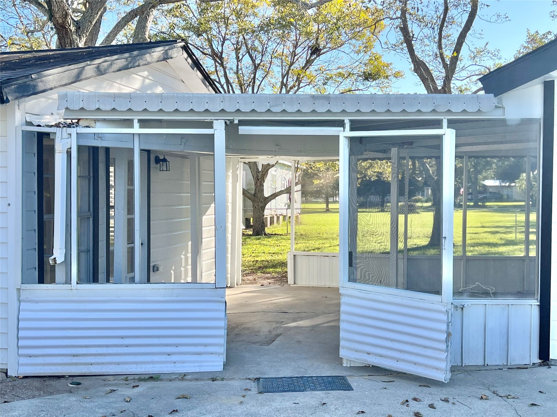 3806 Peck Street, Santa Fe, TX 77517 Coming out of the screened in back patio and going towards the He/She Shed or Home Office and also can cross over to the Kwanza Hut workshop or garage as well!