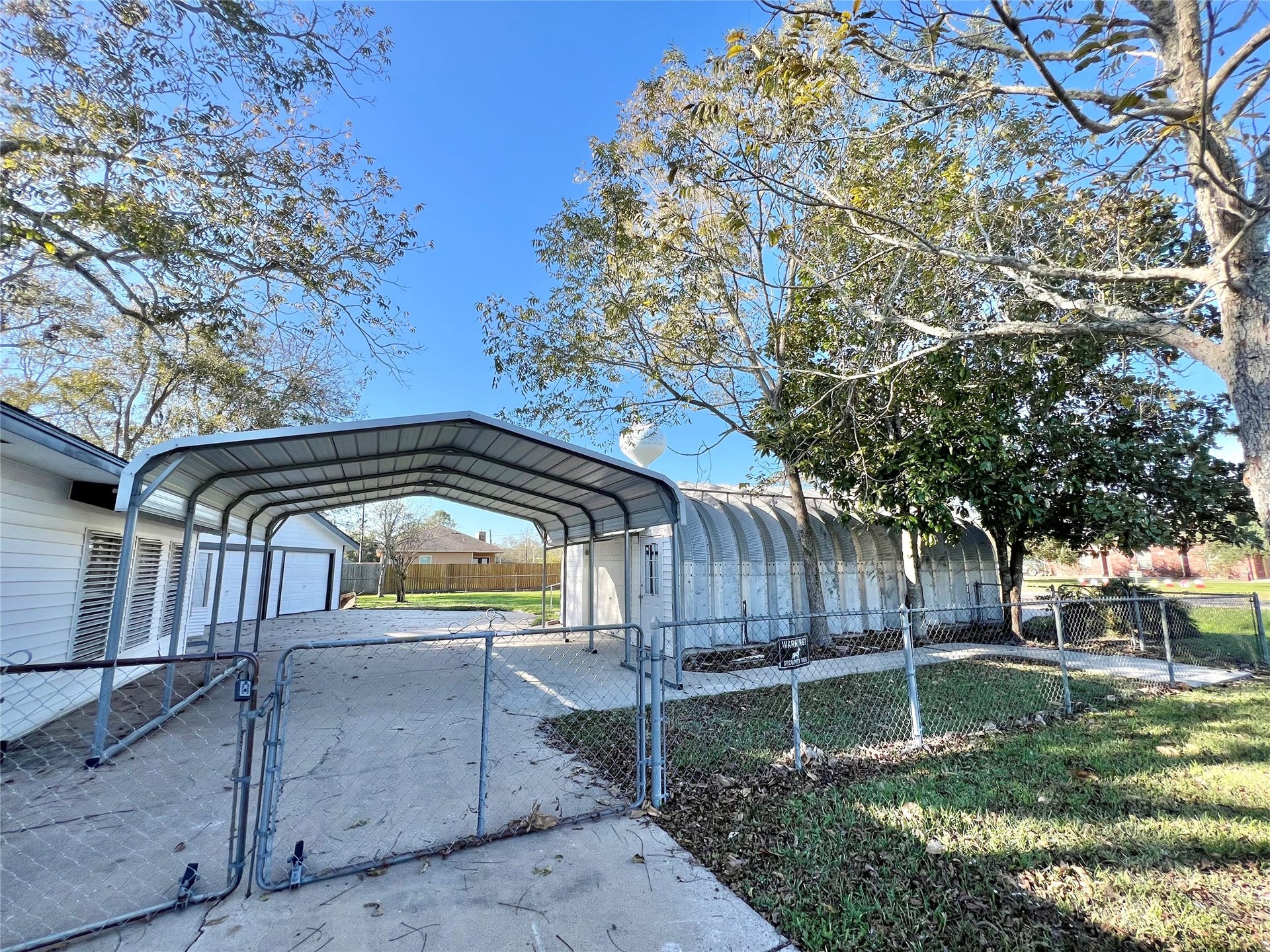 3806 Peck Street, Santa Fe, TX 77517 Huge double Car+ workshop and Kwanza Hut with automatic garage door opener.