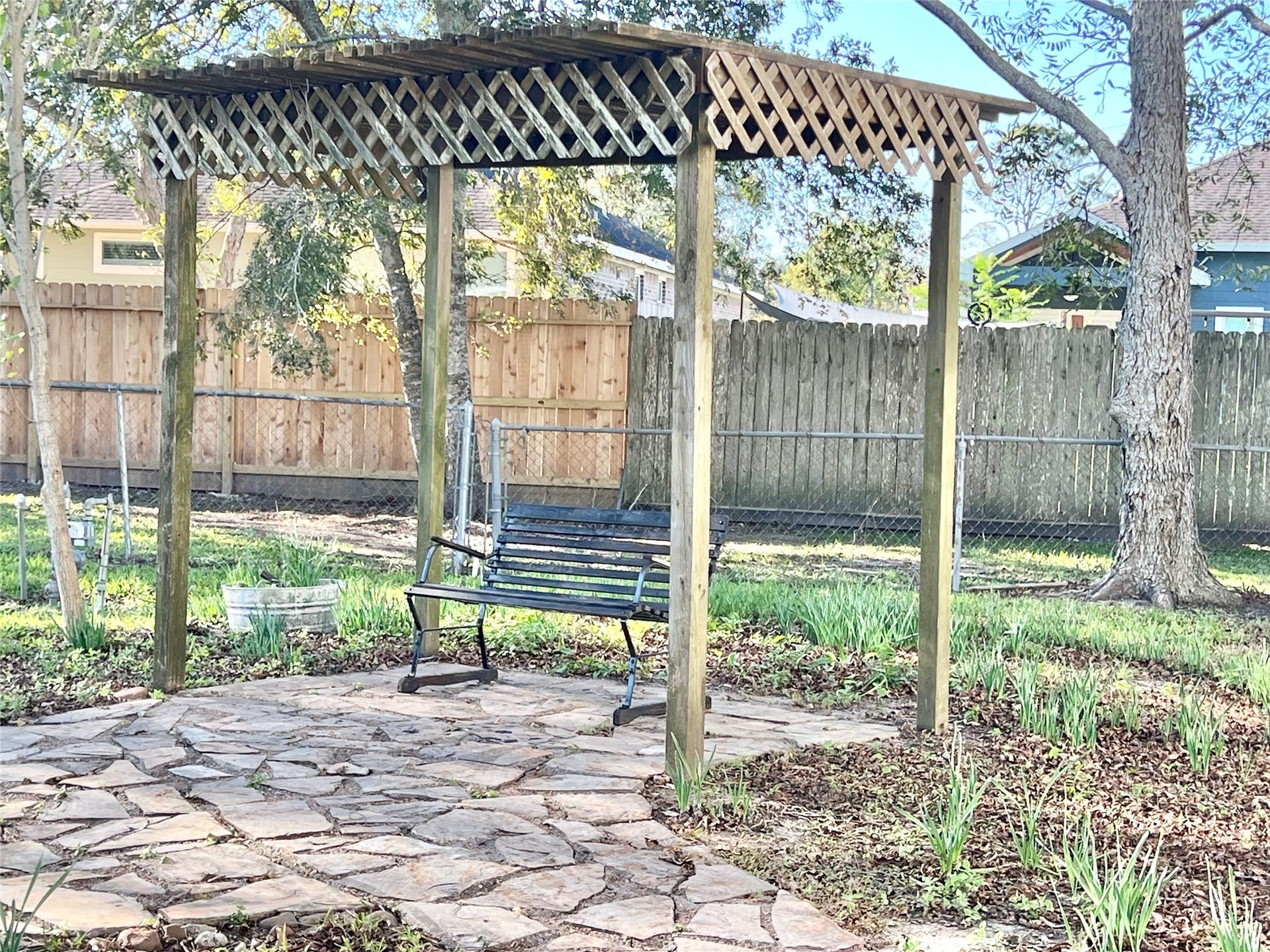 3806 Peck Street, Santa Fe, TX 77517 Want some peace and quiet, need serenity, come and enjoy it all right here, this shaded bench is beckoning you.