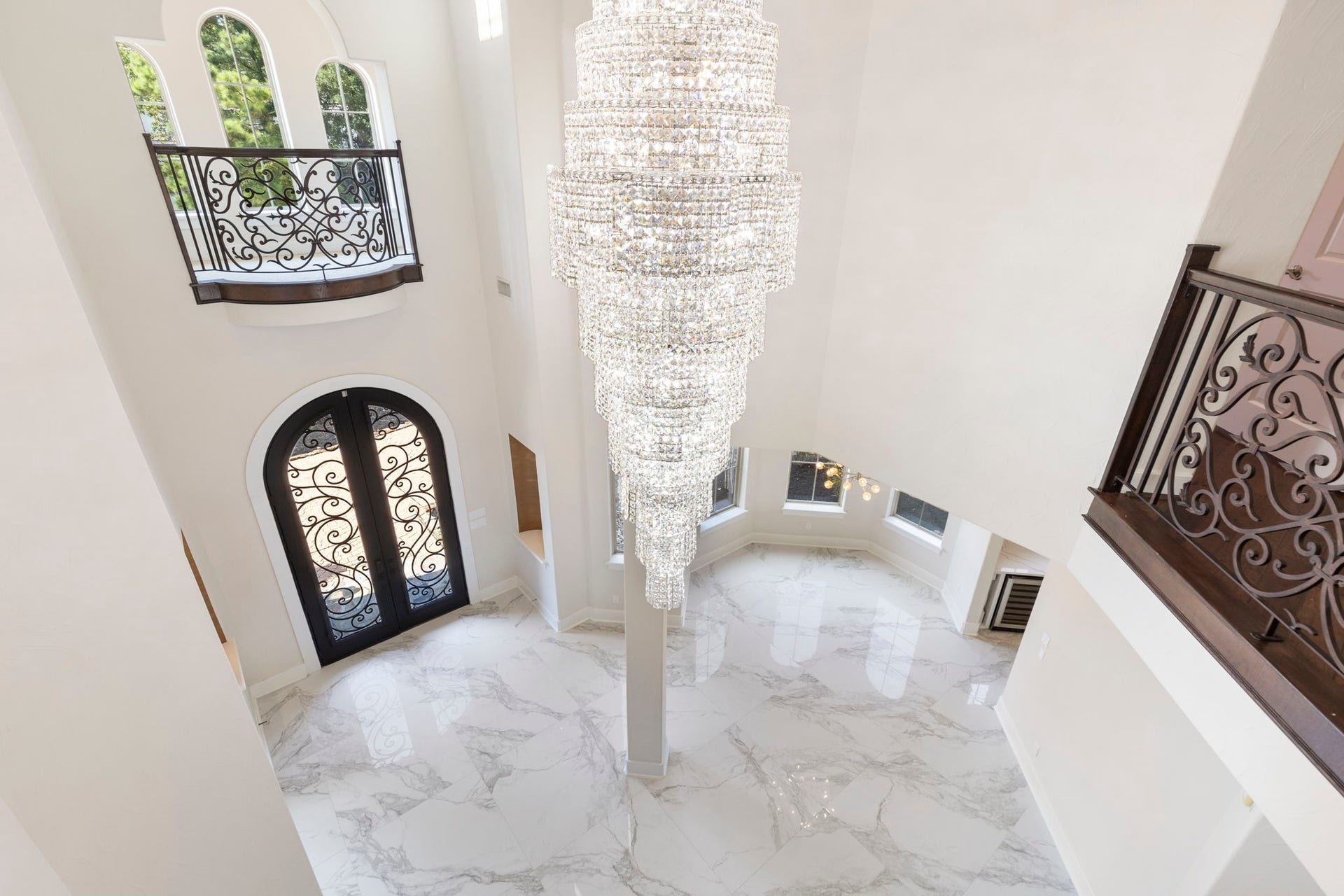 47 Hunnewell Way, The Woodlands, TX 77382 View of the formal entry and showstopper chandelier from the second floor.