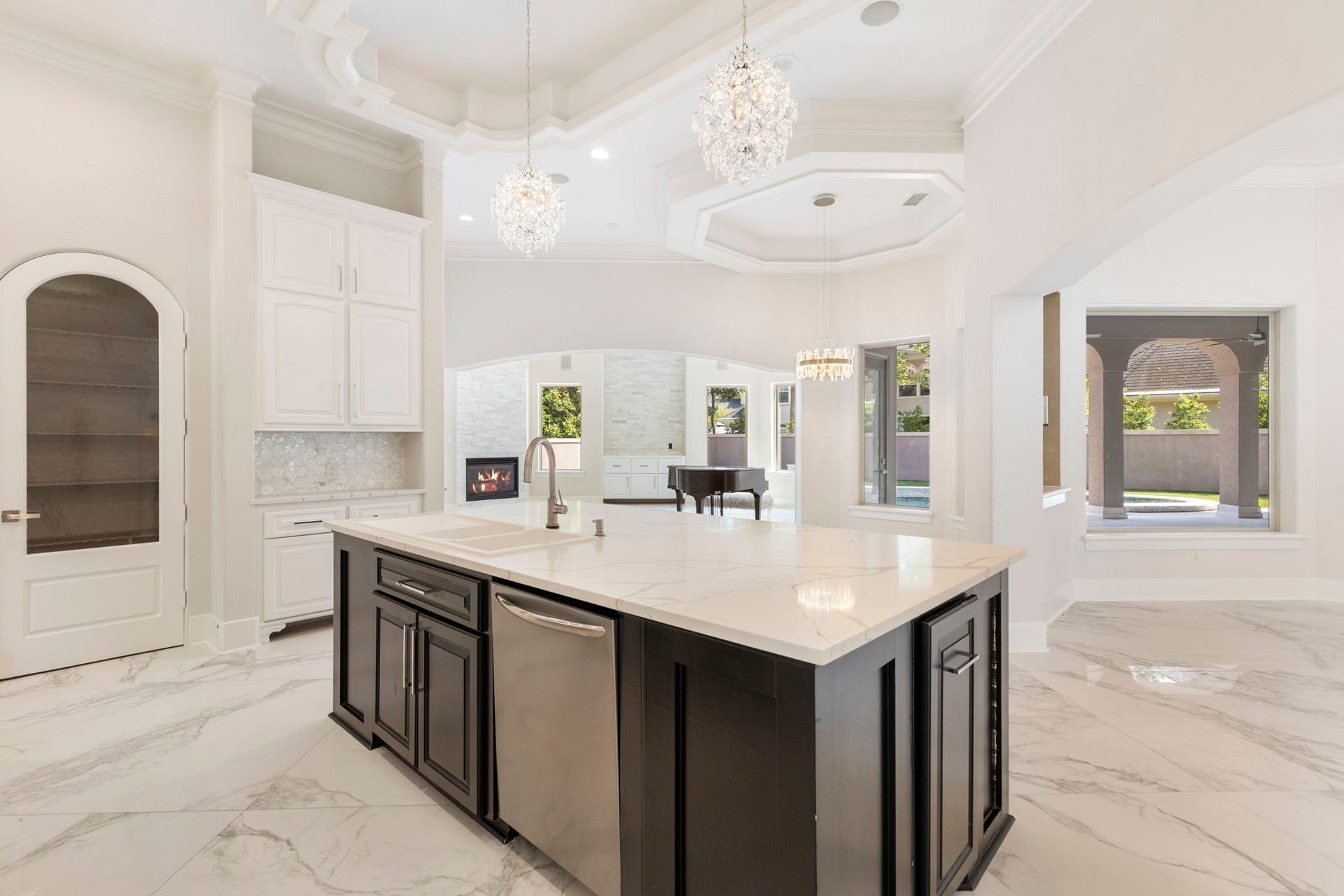 47 Hunnewell Way, The Woodlands, TX 77382 The kitchen island has been transformed from an old-world design into a sleeker, more functional workspace.