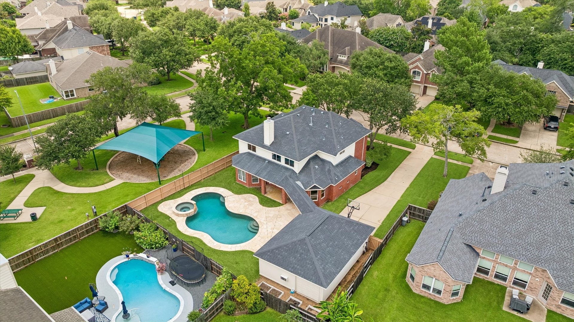 1331 SHADY BEND DRIVE, Sugar Land, TX 77479 An aerial view showcases the home's private pool, detached garage, and prime location next to the neighborhood pocket park.