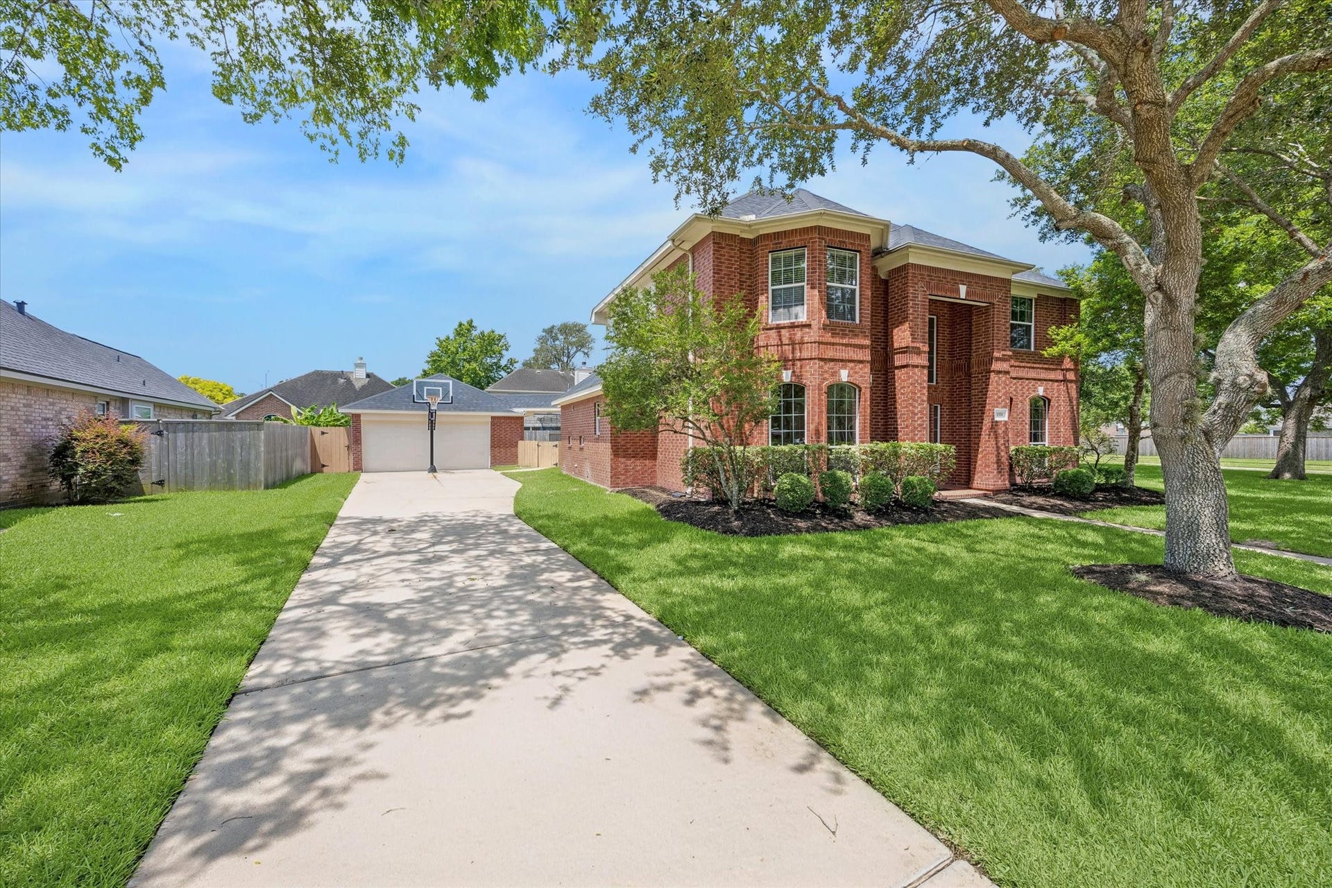1331 SHADY BEND DRIVE, Sugar Land, TX 77479 The extended driveway leads to a detached garage, offering ample parking and added privacy.