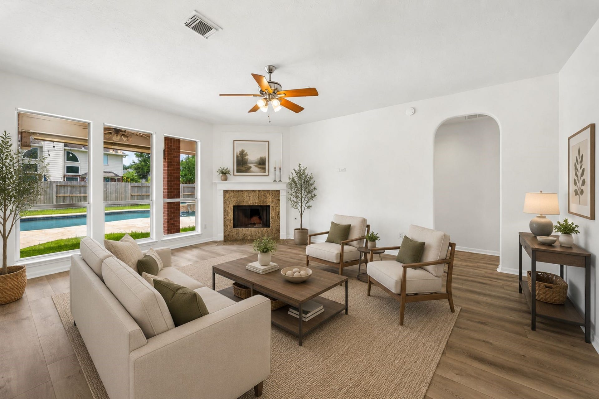 1331 SHADY BEND DRIVE, Sugar Land, TX 77479 The spacious family room features a cozy fireplace and large windows overlooking the pool and backyard. **Virtually Stage.