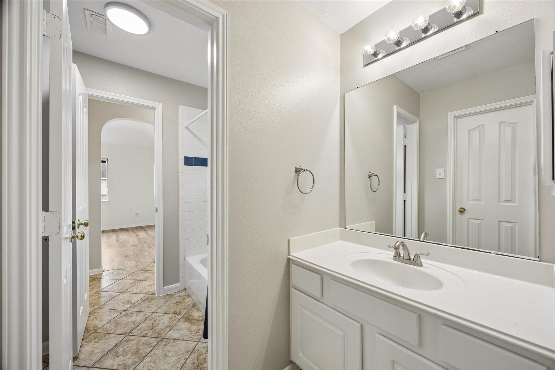 1331 SHADY BEND DRIVE, Sugar Land, TX 77479 Another view of the upstairs vanity highlights its functional layout and shared access.